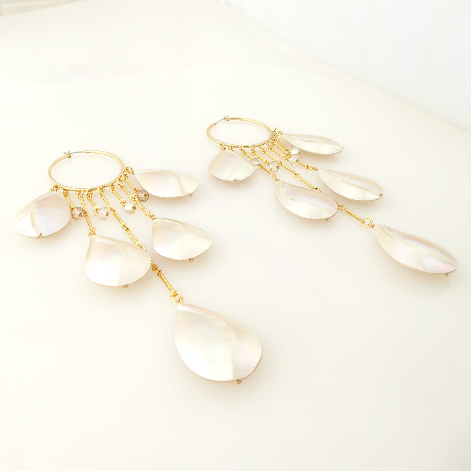 Raindrop shell hoop earrings by Jenny Dayco 2