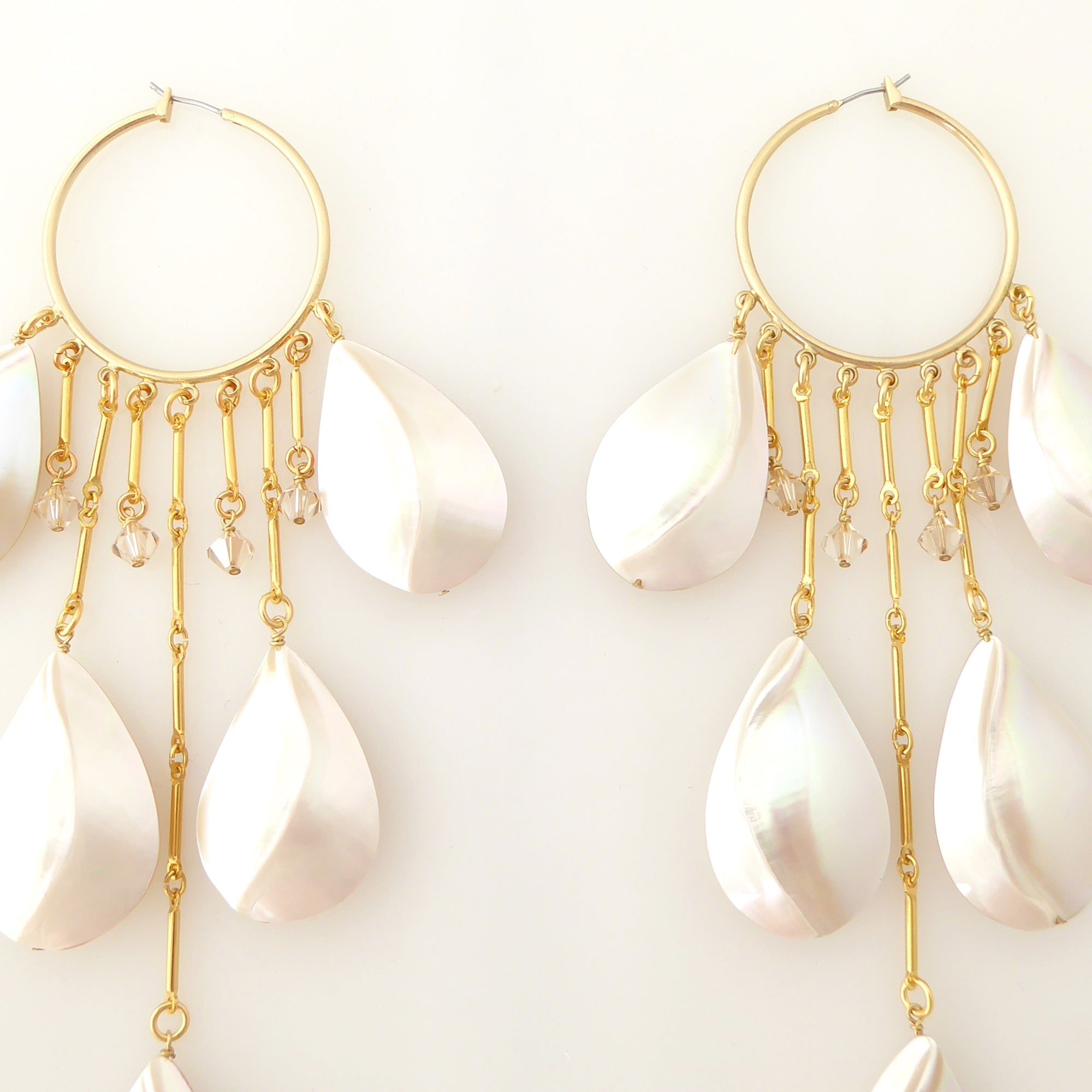 Raindrop shell hoop earrings by Jenny Dayco 4