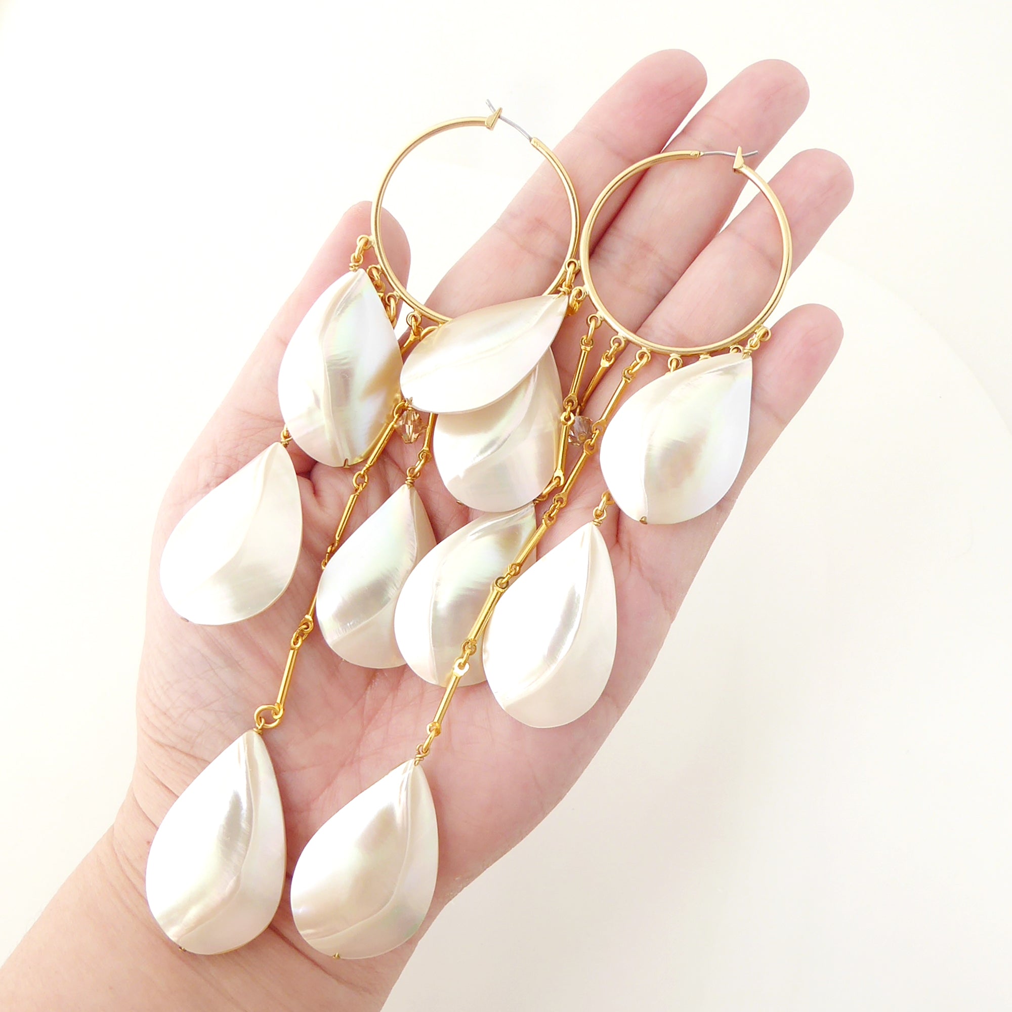 Raindrop shell hoop earrings by Jenny Dayco 6