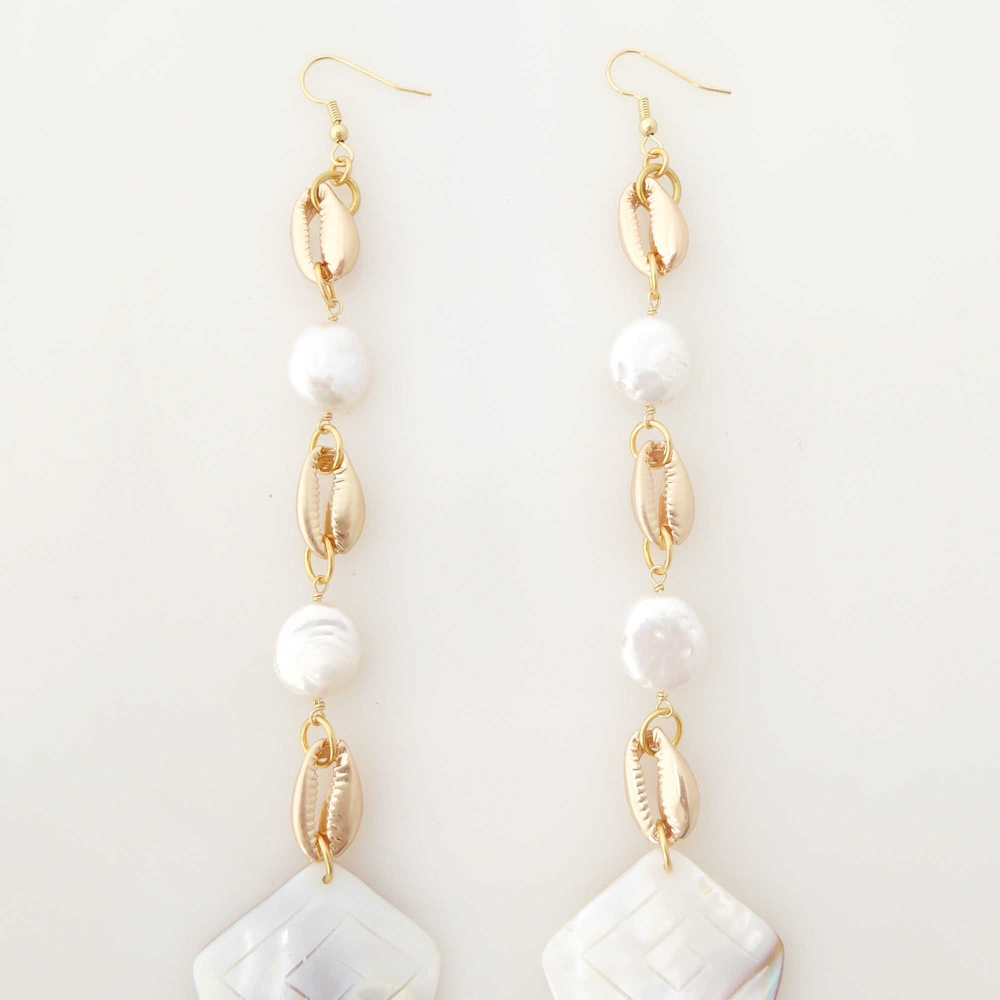 Cowrie shell and pearl earrings by Jenny Dayco 5