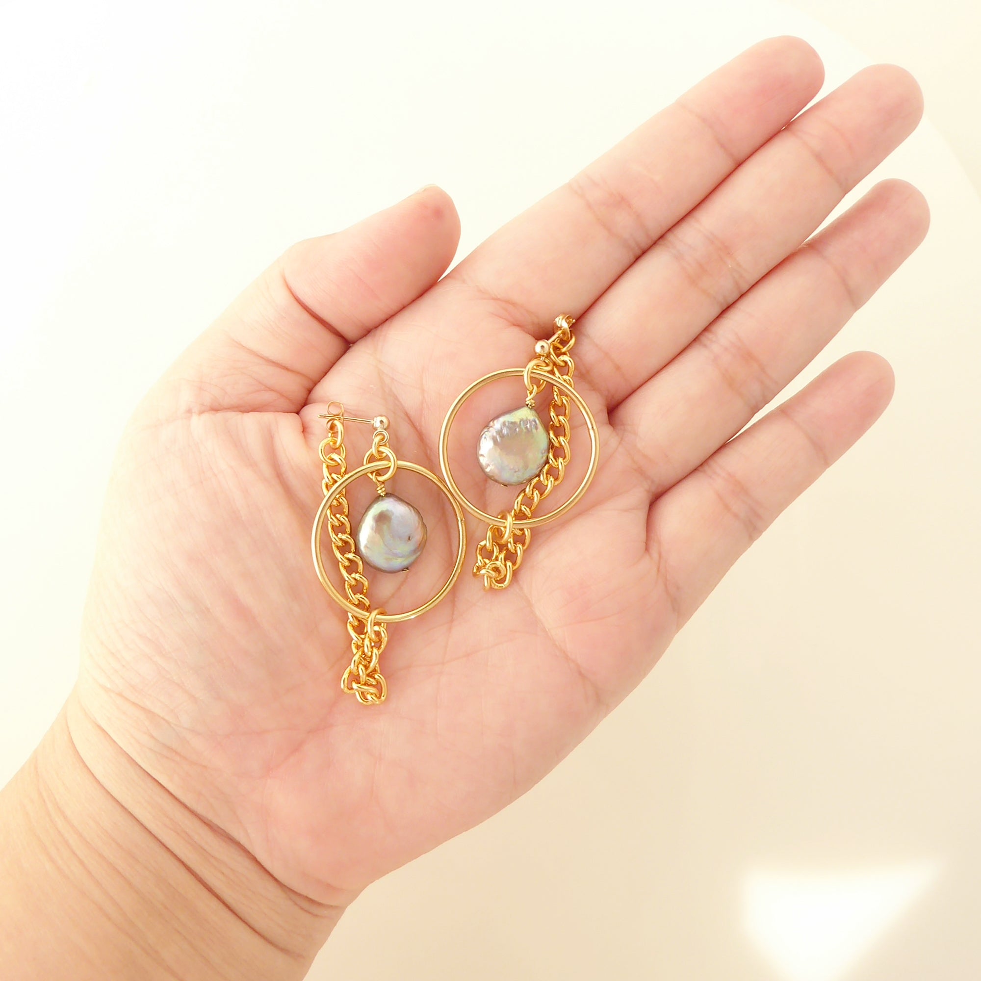 Gold saturn earrings in gray pearl by Jenny Dayco 5