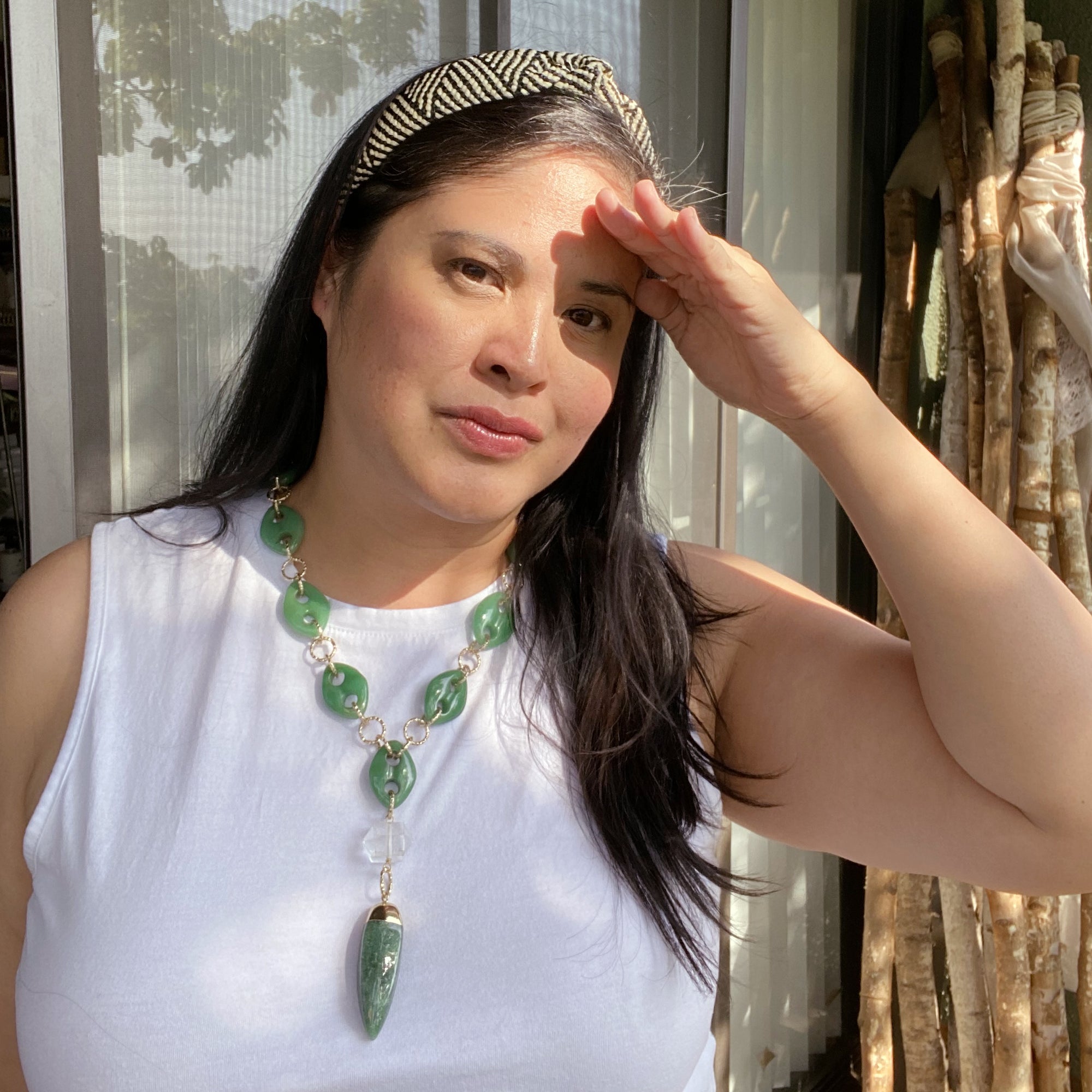 Jenny Dayco wearing a green quartz spike and green aventurine necklace
