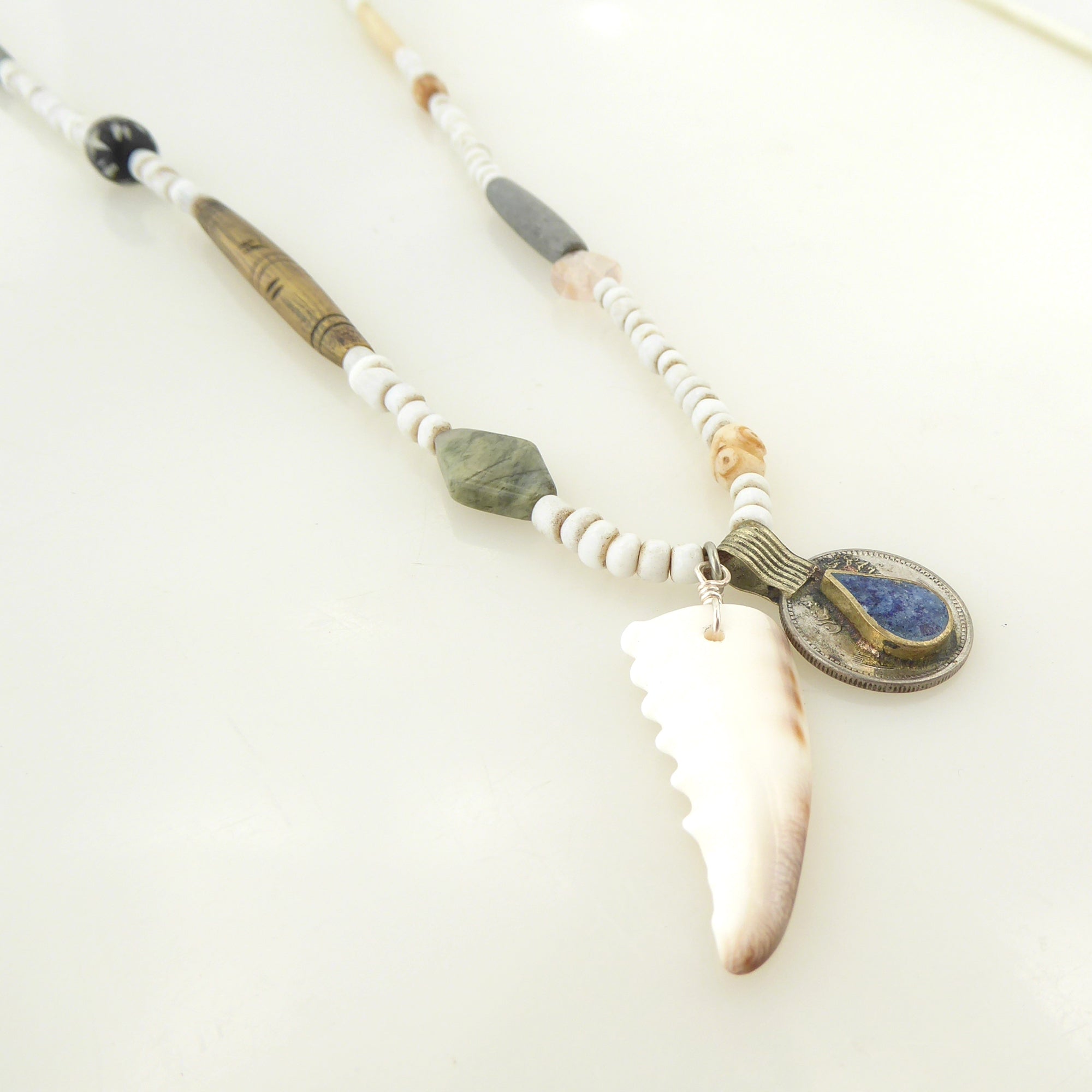 Cowrie shell and lapis lazuli coin necklace by Jenny Dayco 2