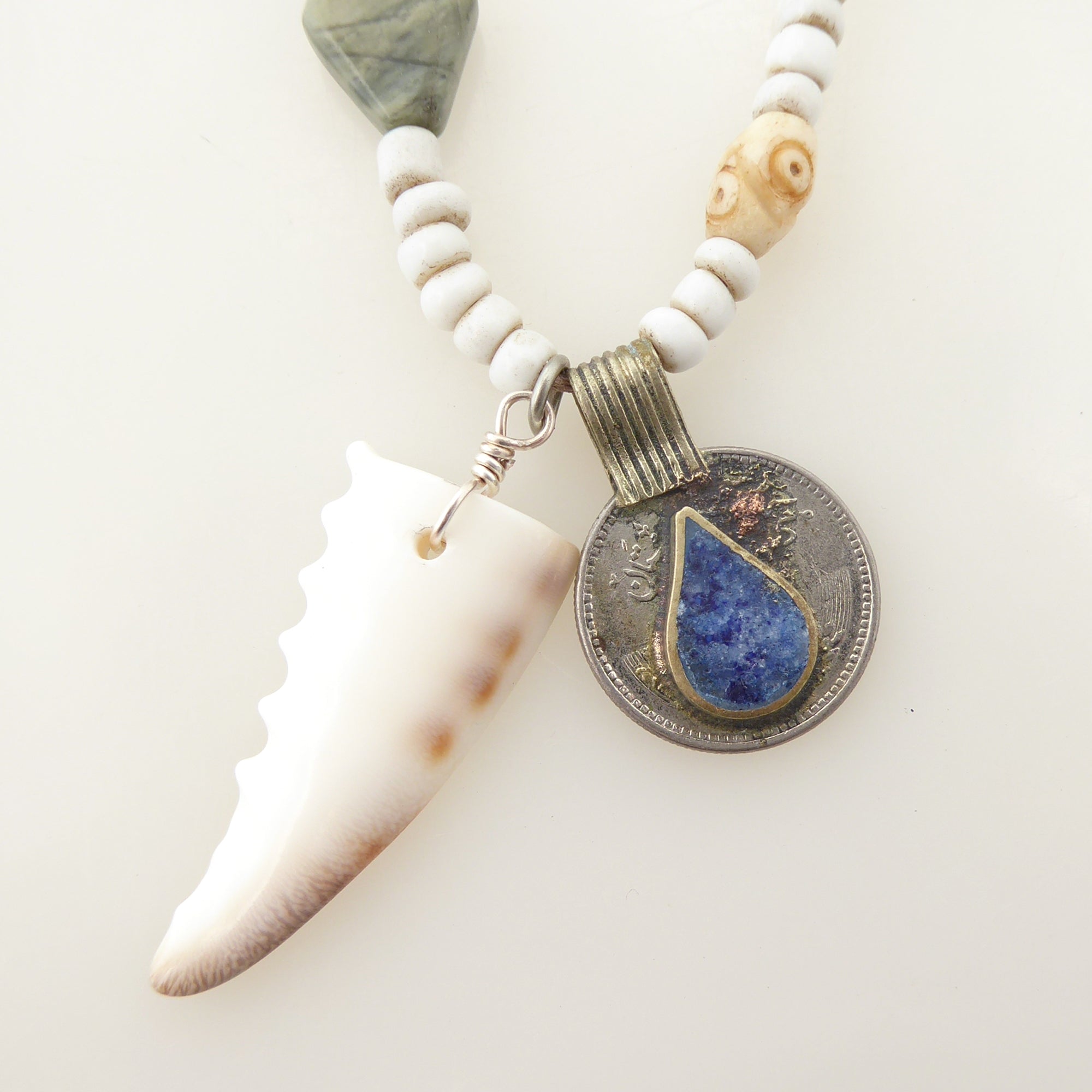 Cowrie shell and lapis lazuli coin necklace by Jenny Dayco 4