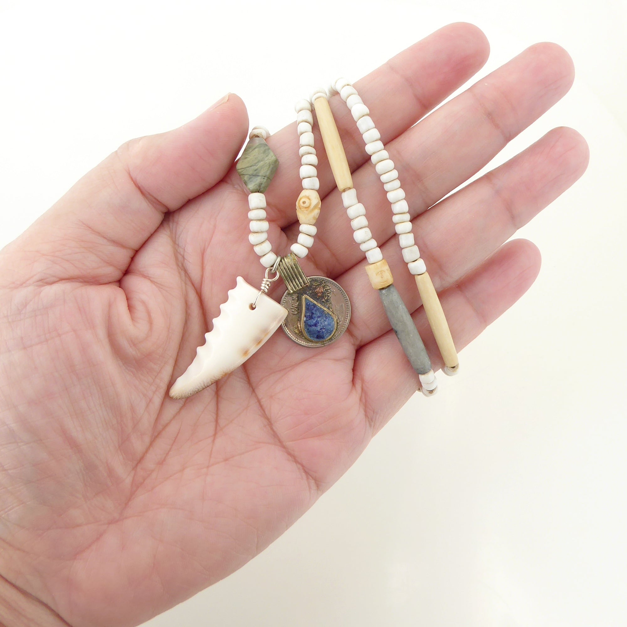 Cowrie shell and lapis lazuli coin necklace by Jenny Dayco 7