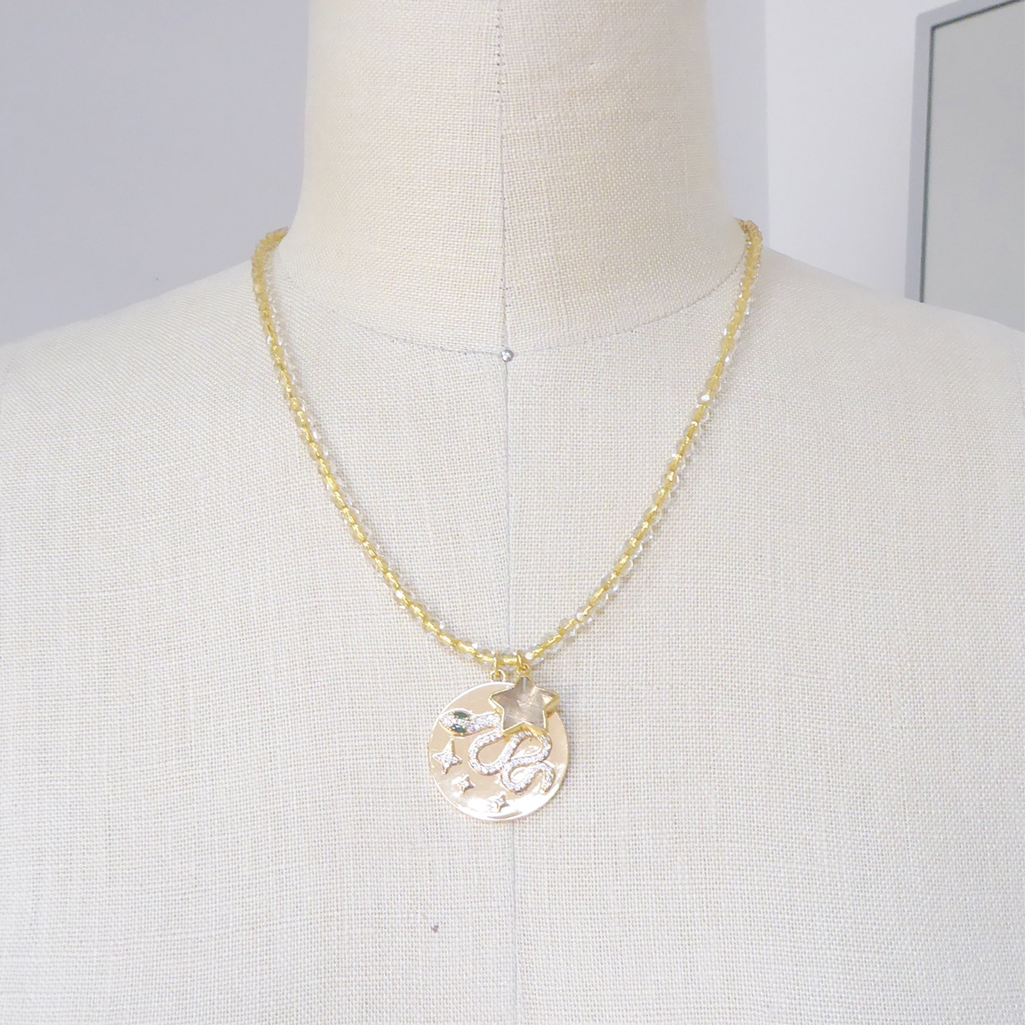 Gold snake medallion necklace by Jenny Dayco 6