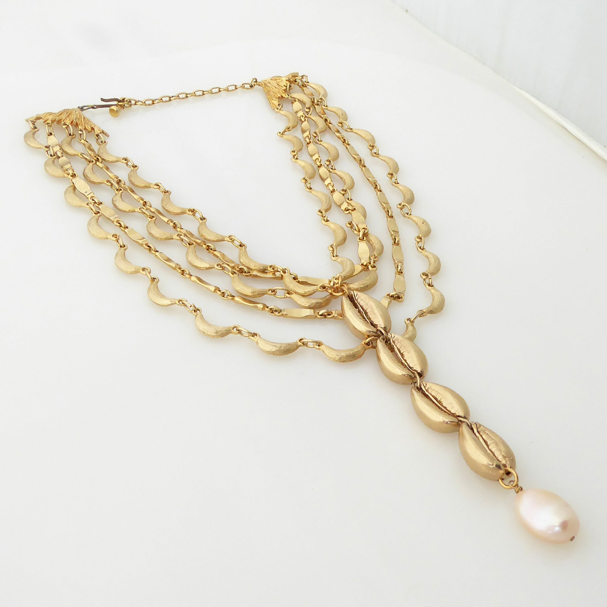 Gold cowrie shell and pearl necklace by Jenny Dayco 2
