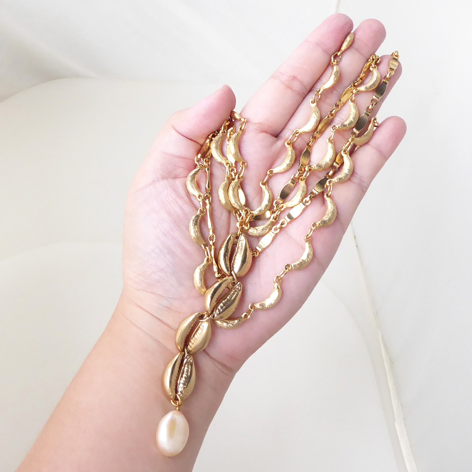 Gold cowrie shell and pearl necklace by Jenny Dayco 7