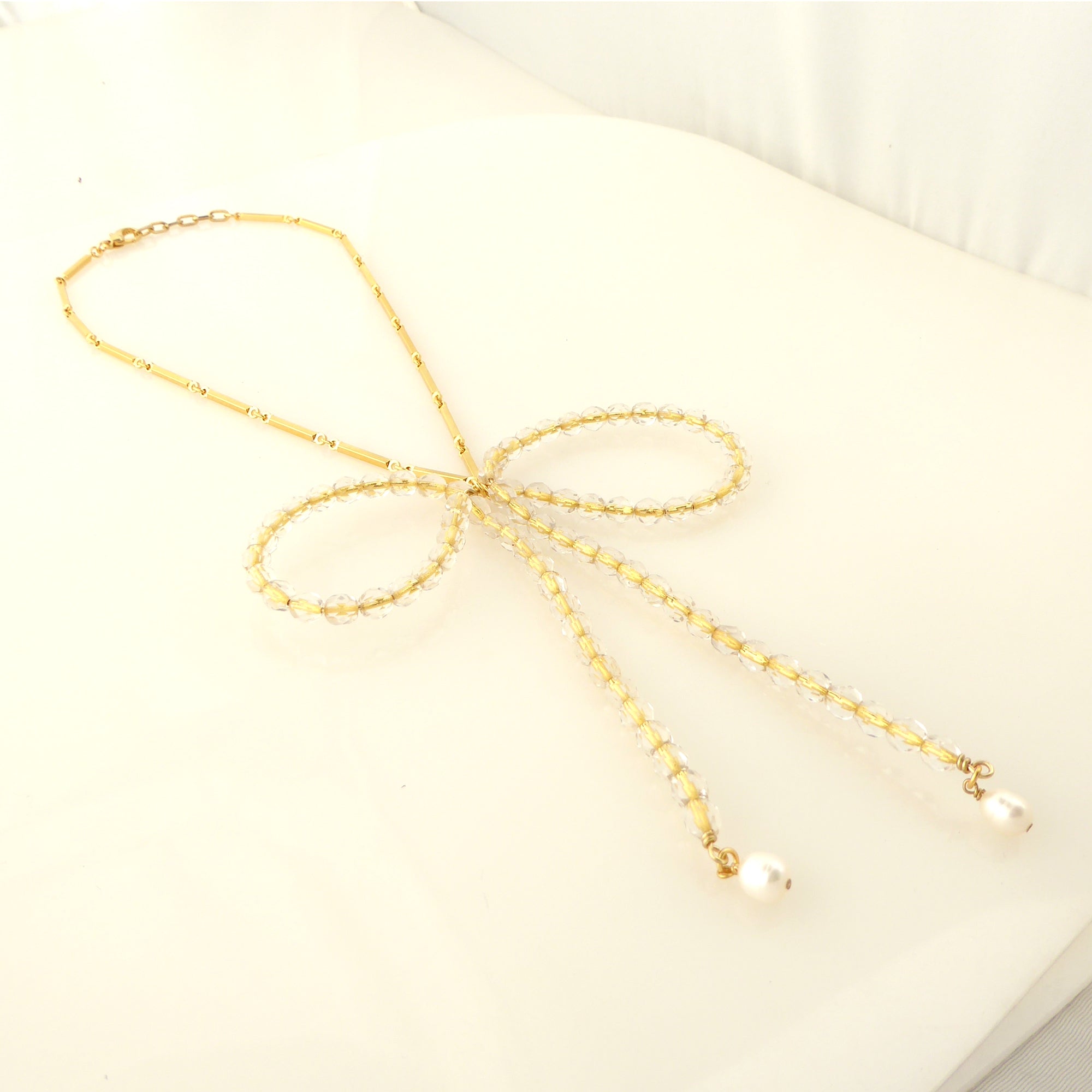 Golden beaded bow necklace by Jenny Dayco 2