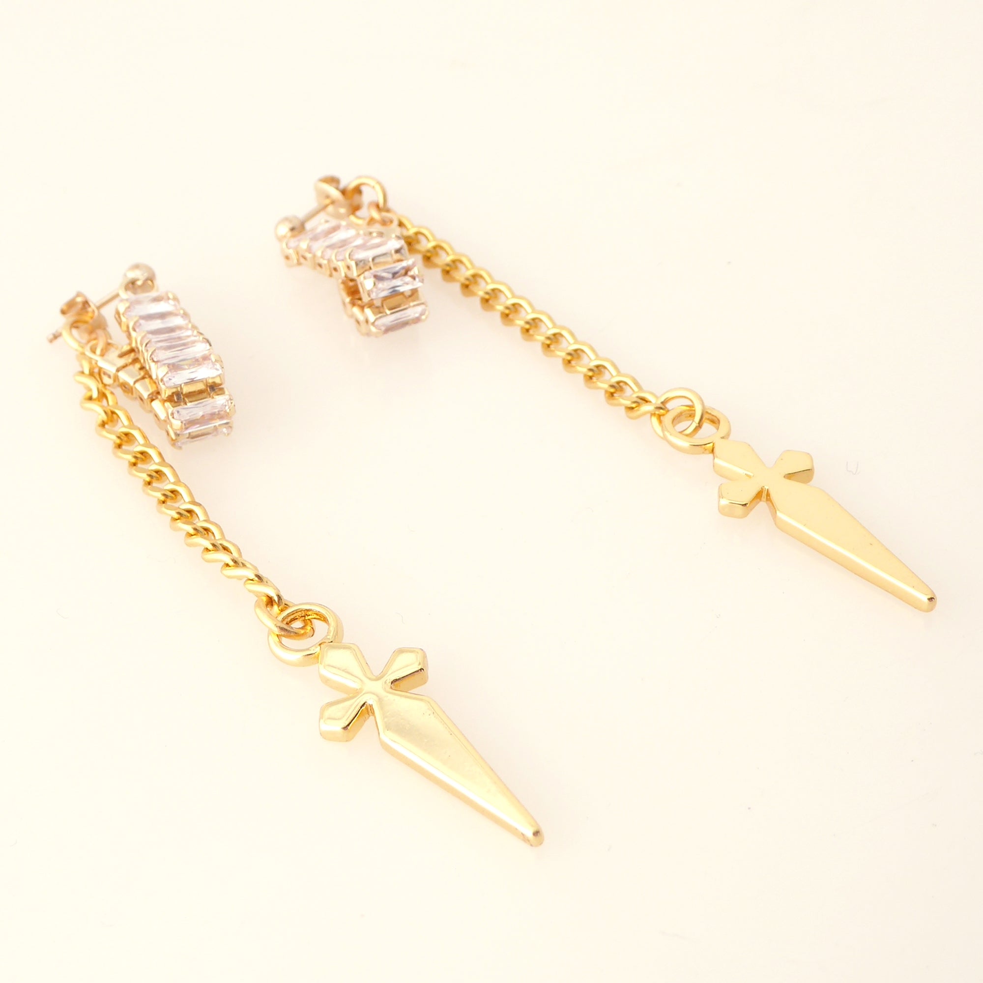 Gold rhinestone baguette dagger earrings