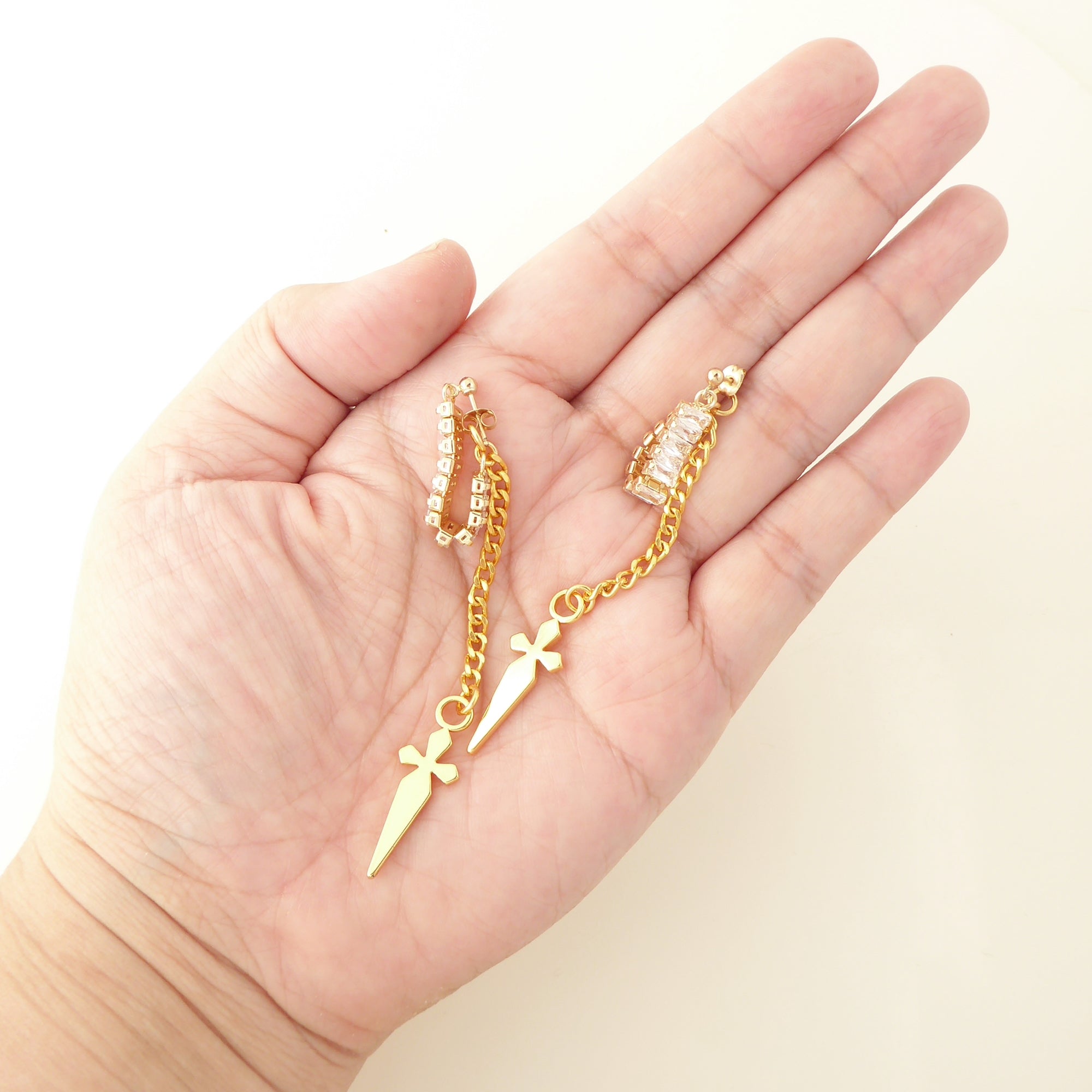 Gold rhinestone baguette dagger earrings