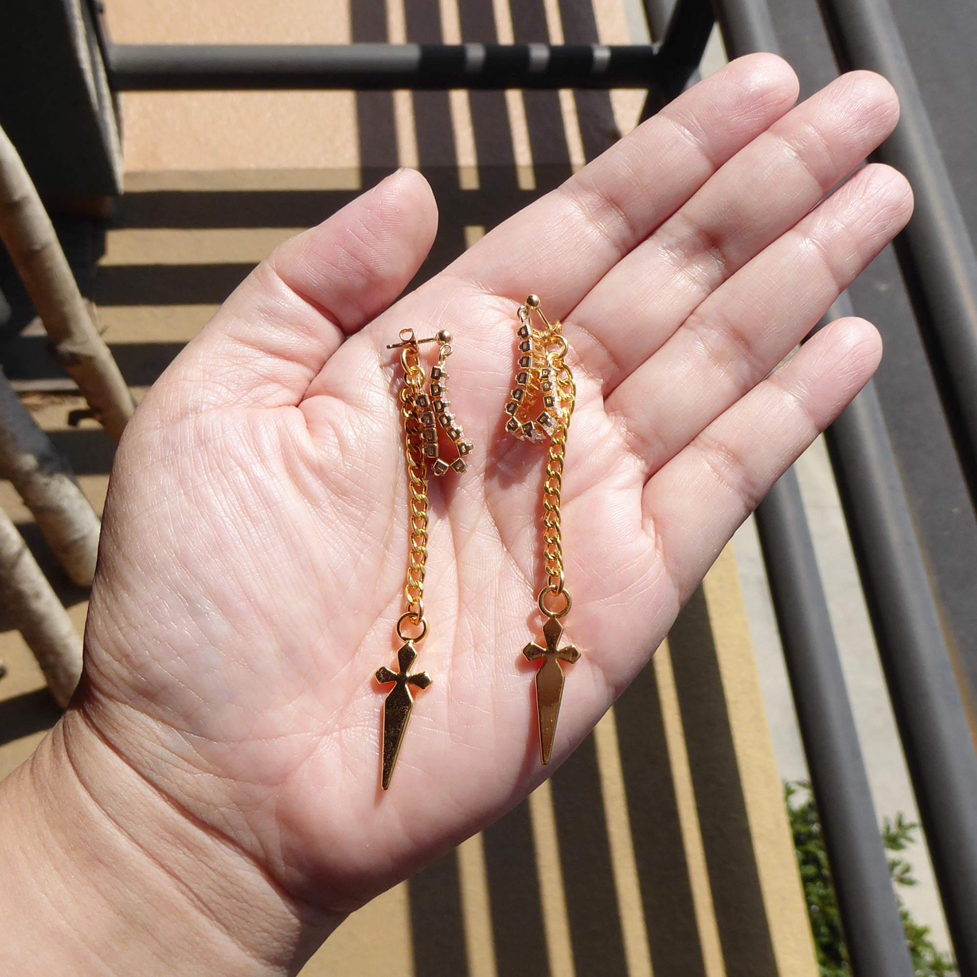 Gold rhinestone baguette dagger earrings