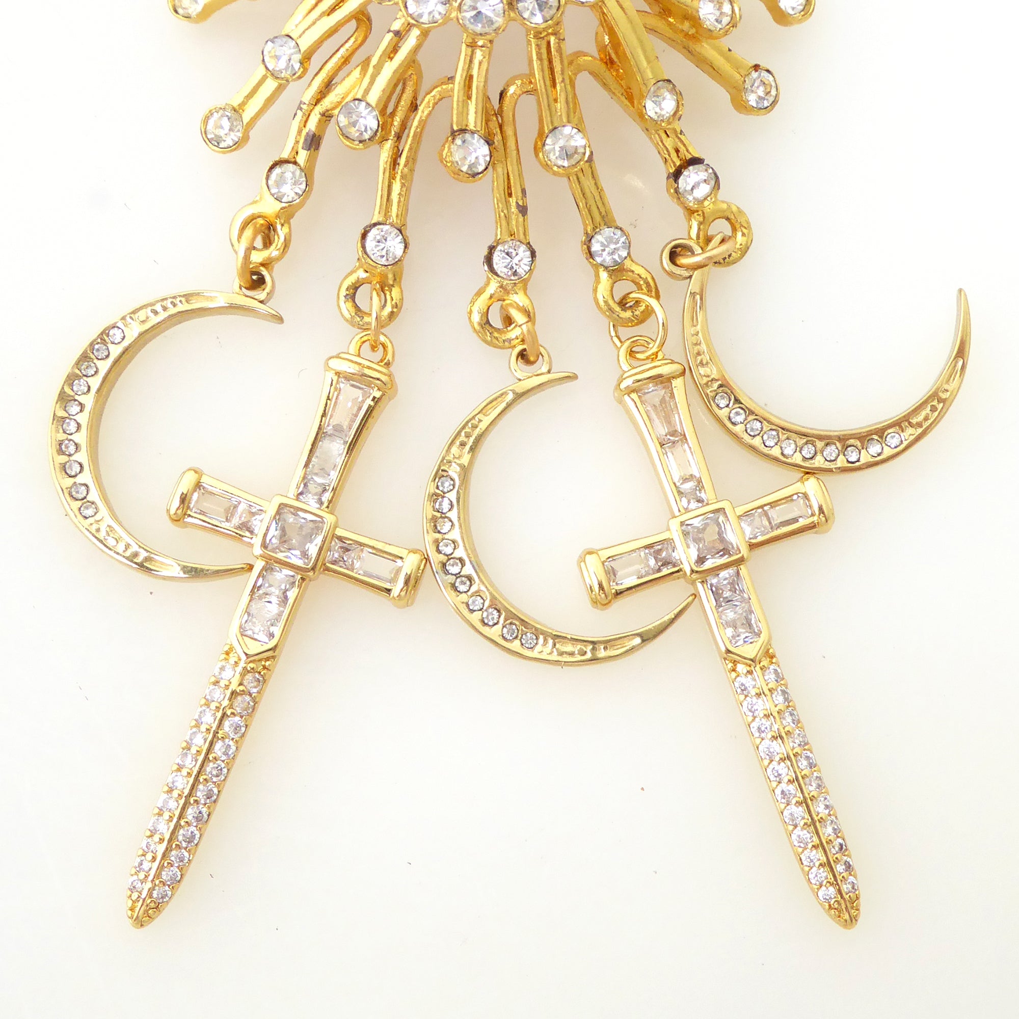 Gold suncatcher moon and dagger brooch by Jenny Dayco 4
