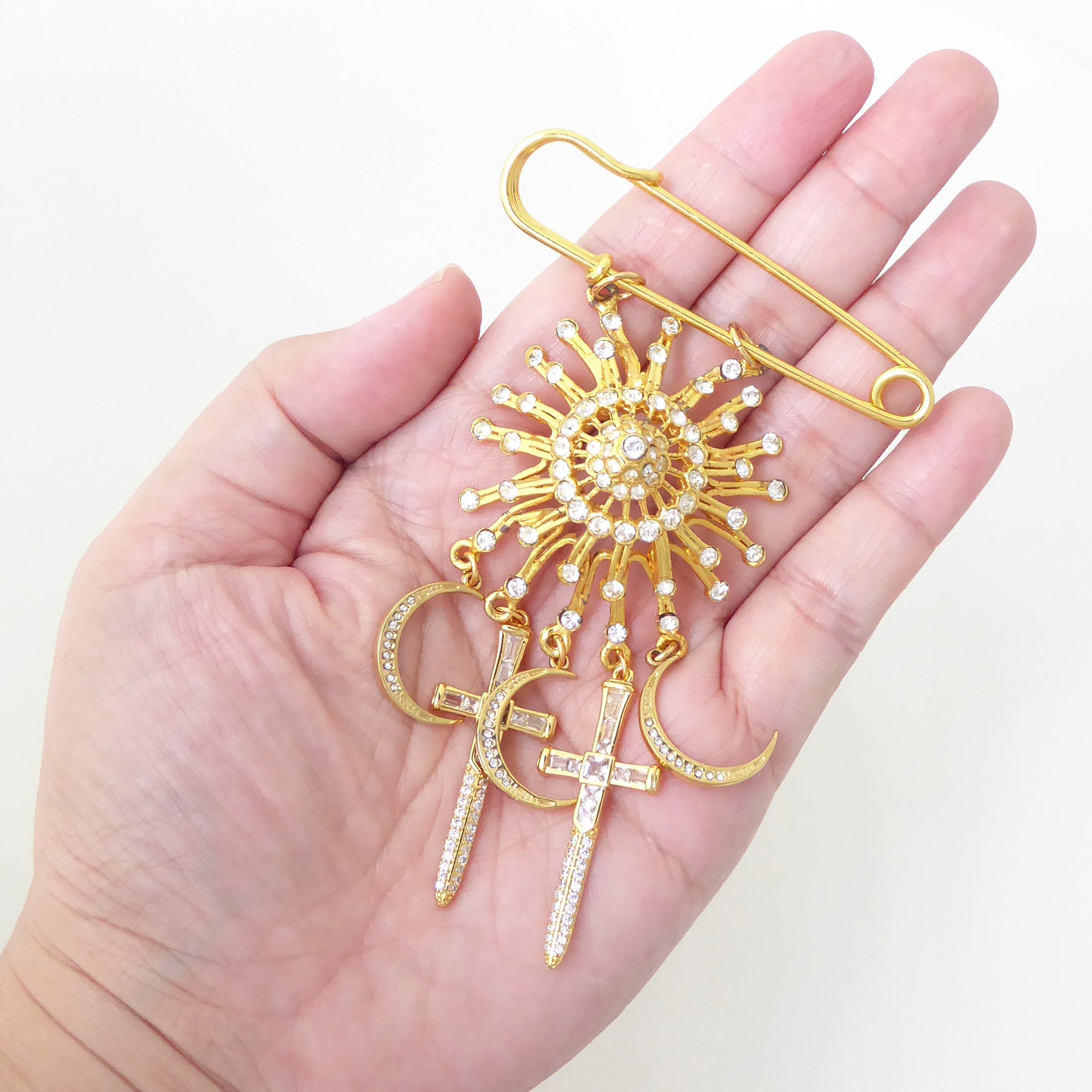 Gold suncatcher moon and dagger brooch by Jenny Dayco 6
