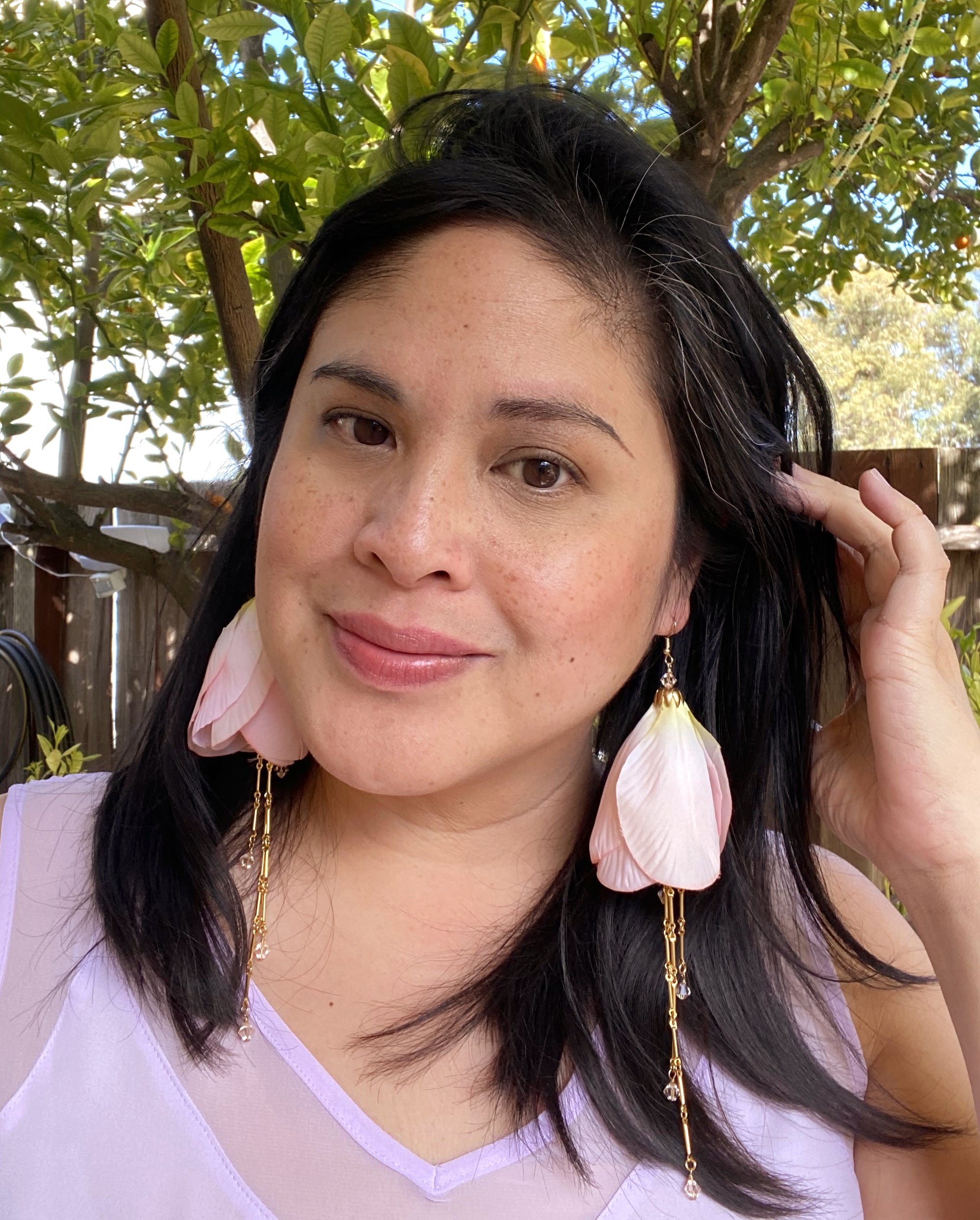 Jenny Dayco wearing pink beaded tulip earrings