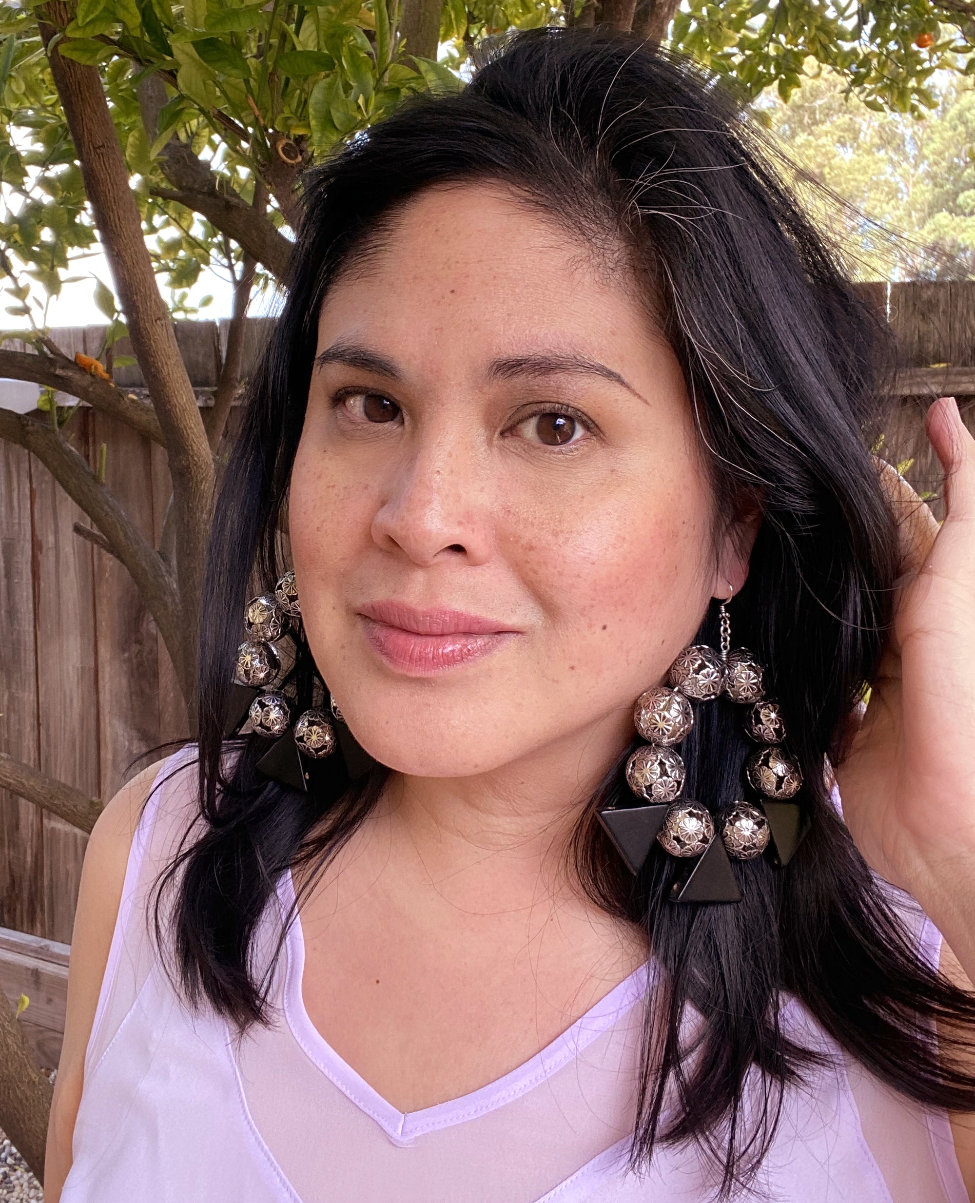 Jenny Dayco wearing ramonda earrings