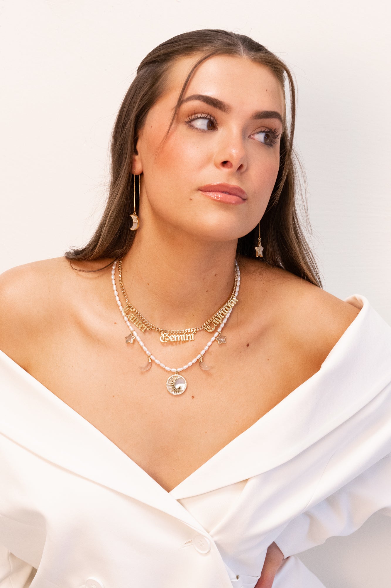 Jenny Dayco necklaces and earrings on model 1