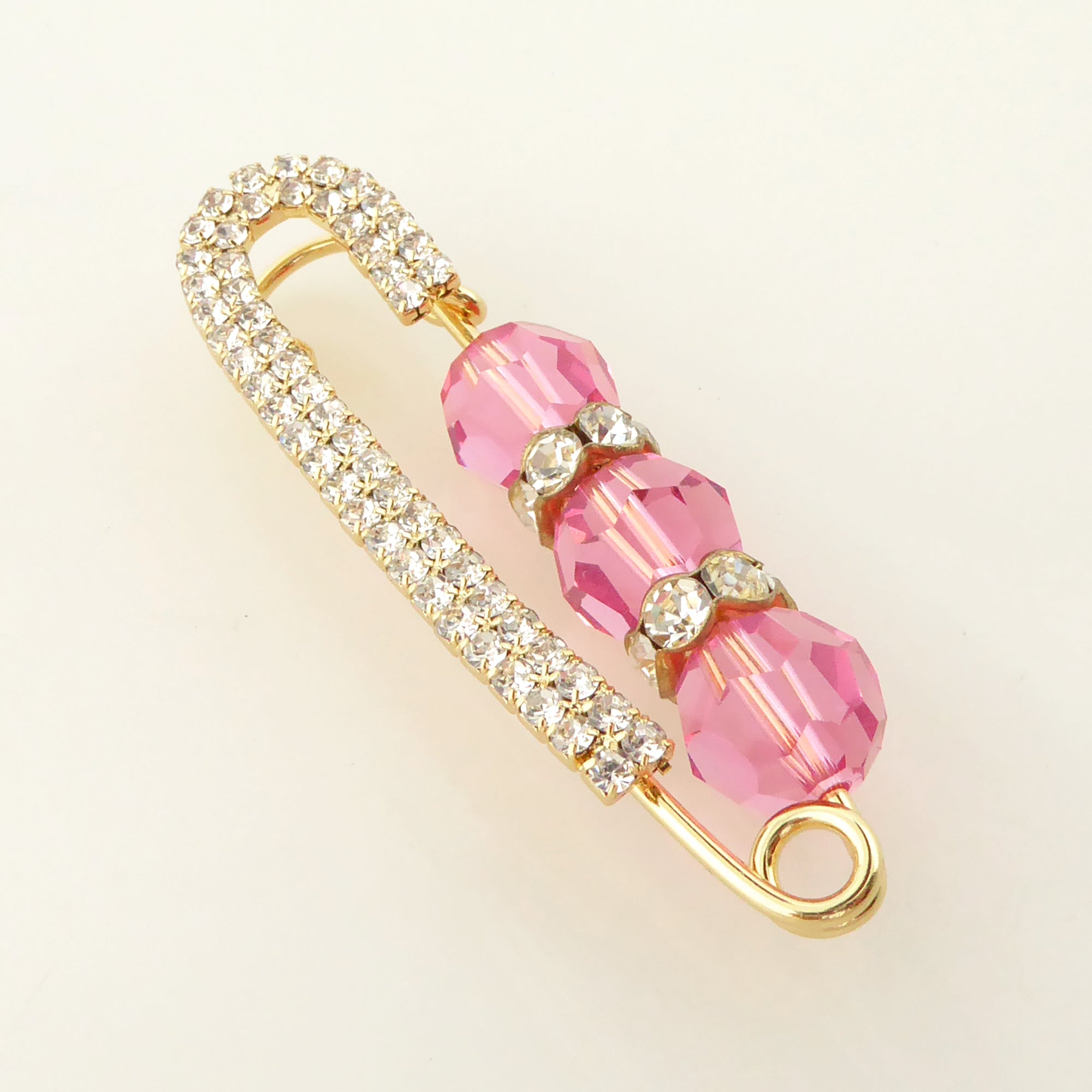 Pink crystal and gold rhinestone safety pin brooch