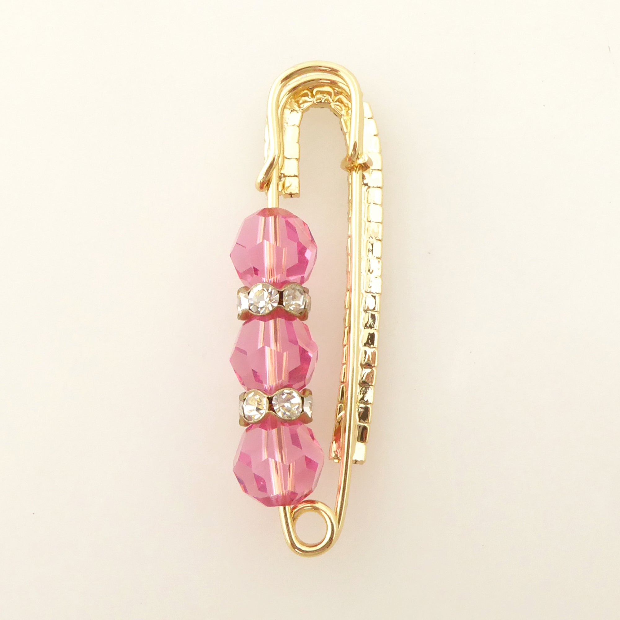 Pink crystal and gold rhinestone safety pin brooch