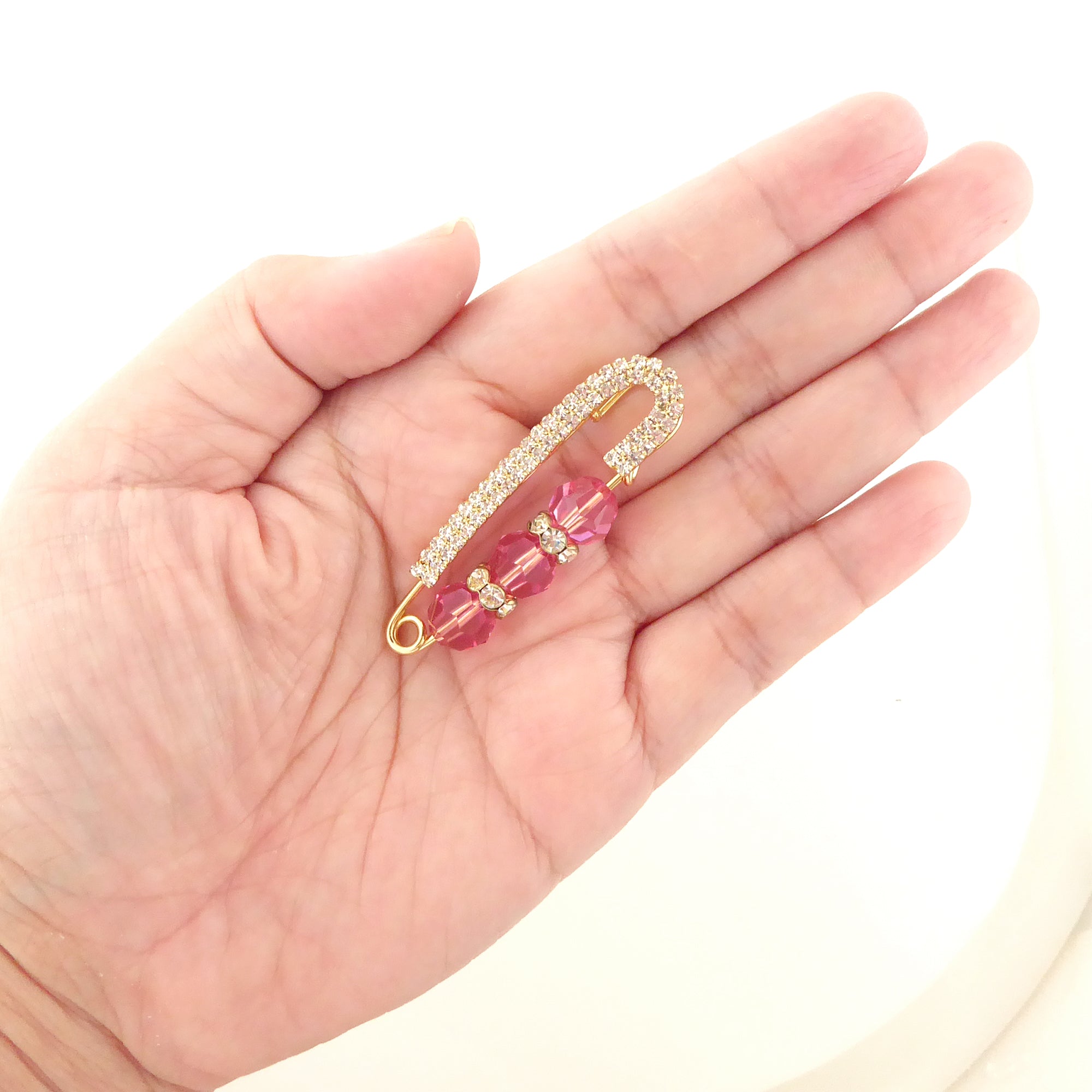 Pink crystal and gold rhinestone safety pin brooch