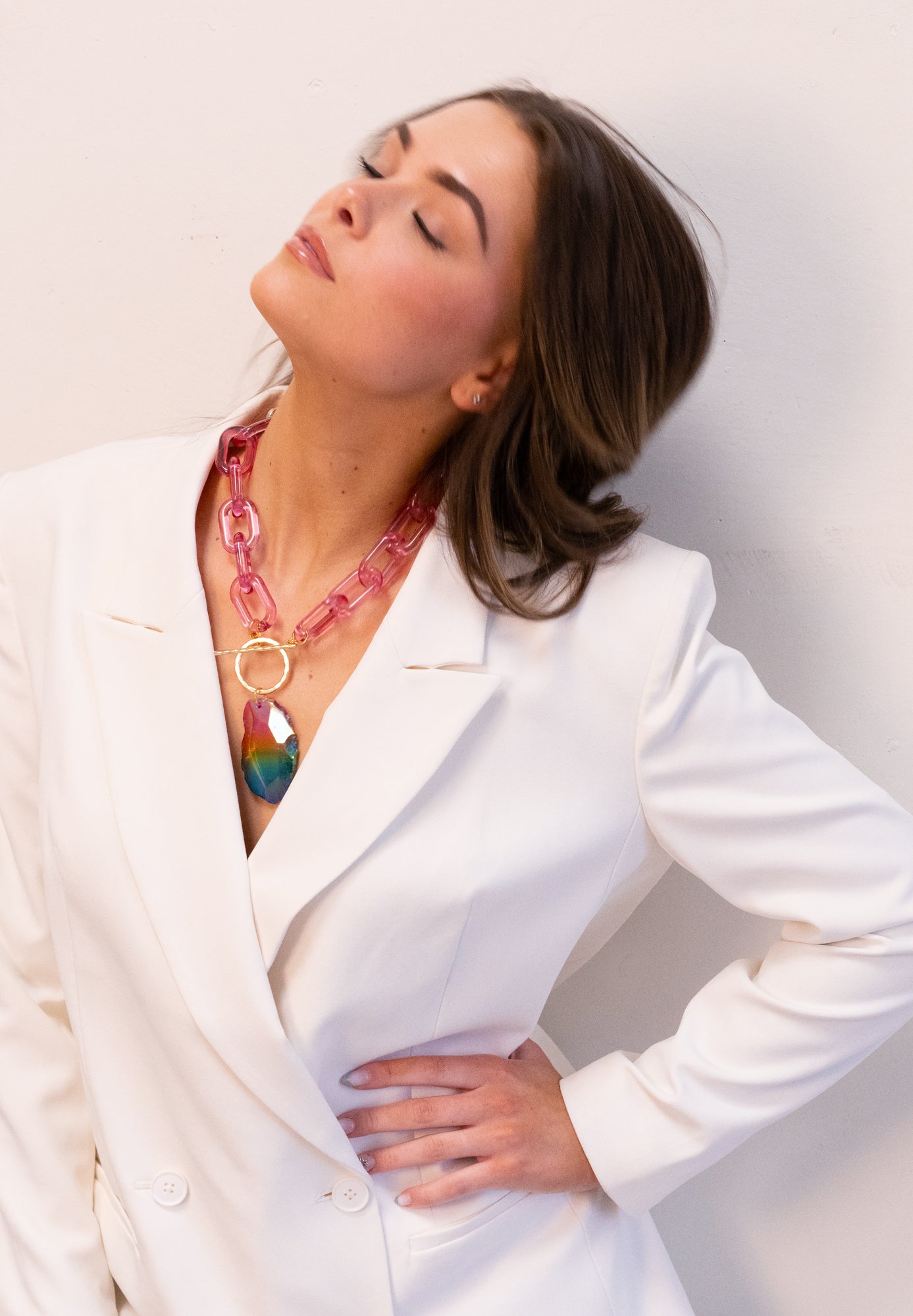 Rainbow agate pendant necklace on model by Jenny Dayco 1