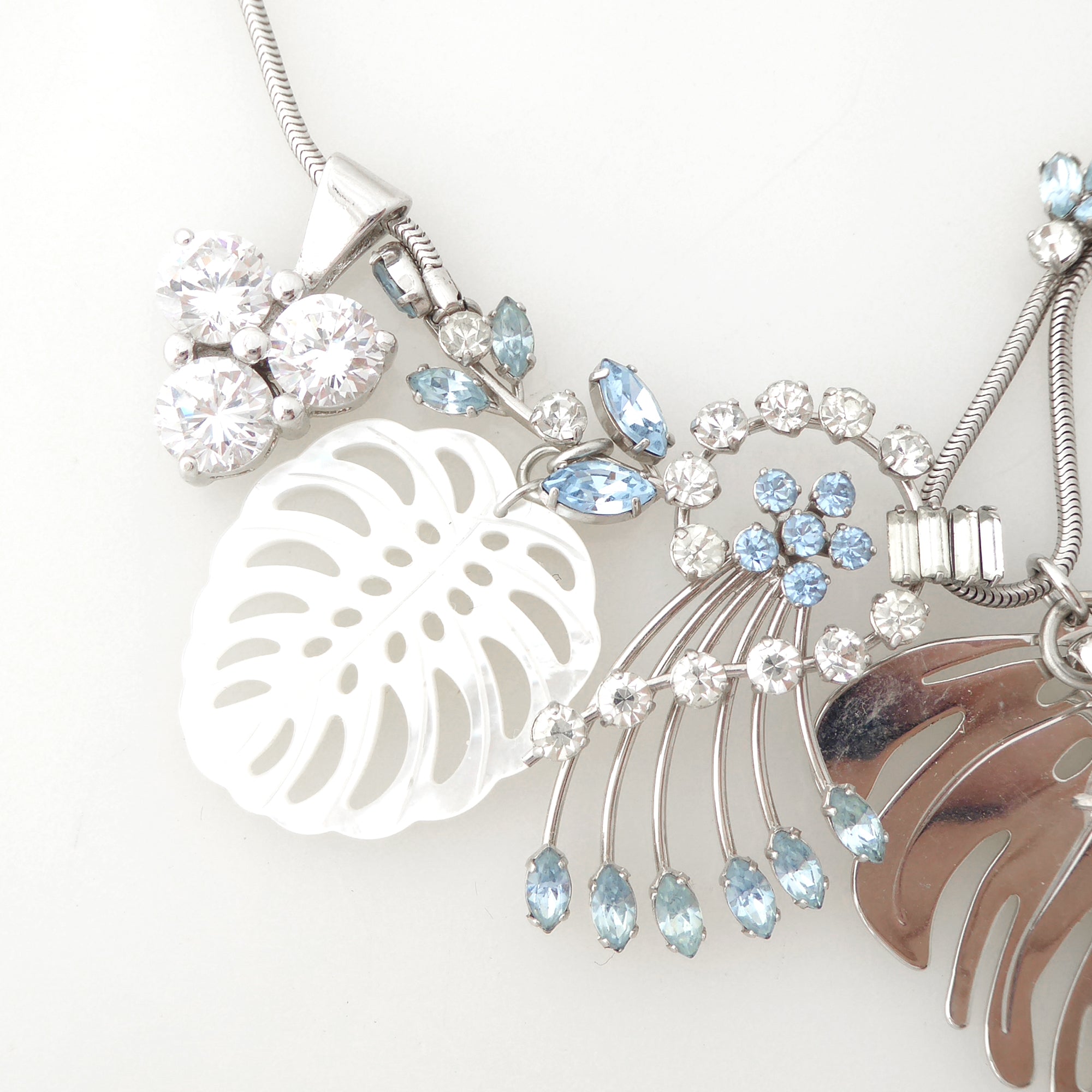 Silver monstera leaf cluster necklace by Jenny Dayco 4