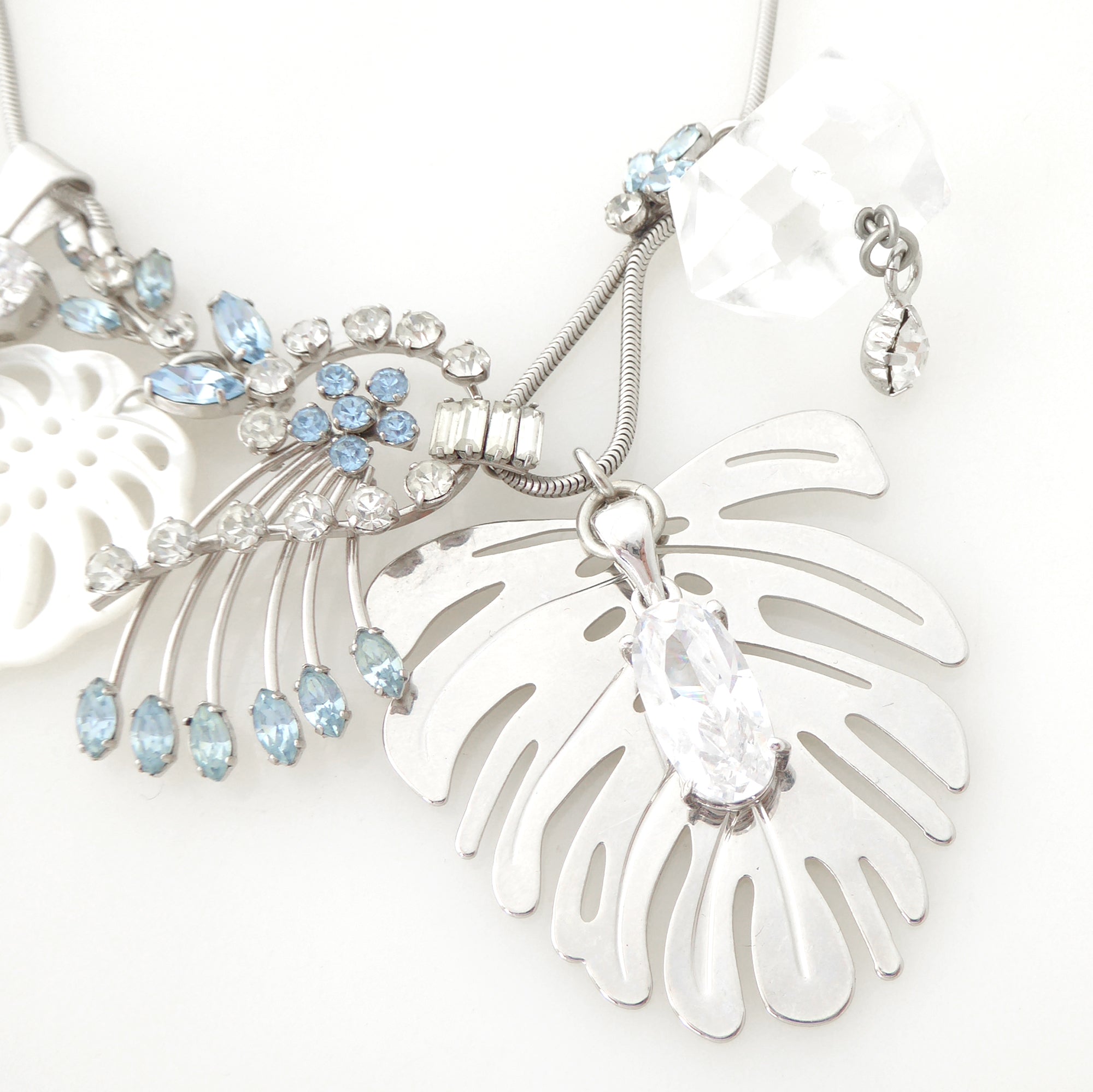 Silver monstera leaf cluster necklace by Jenny Dayco 5
