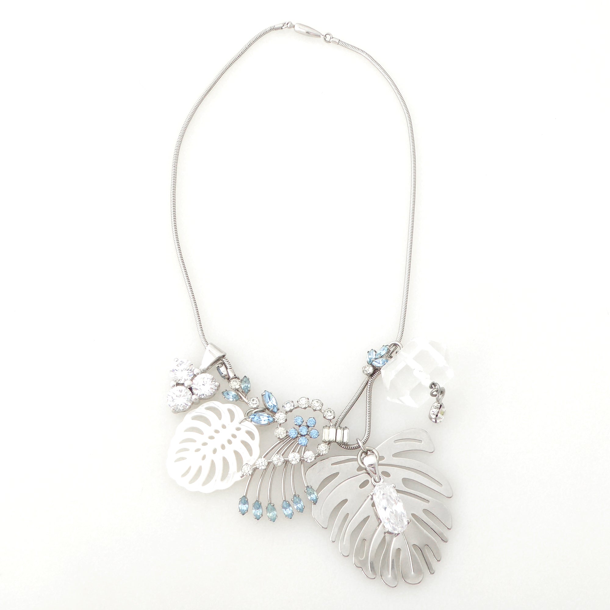 Silver monstera leaf cluster necklace by Jenny Dayco 6