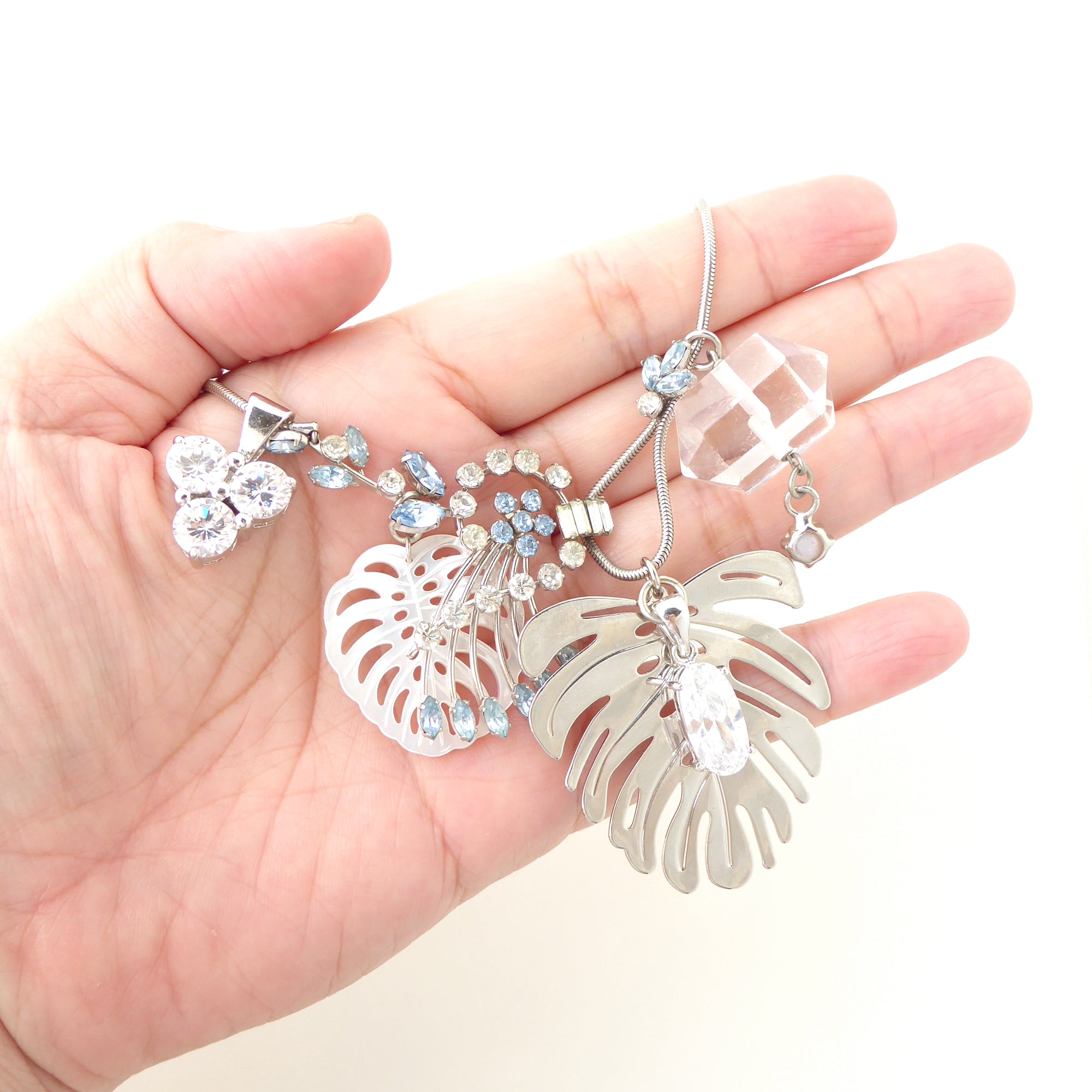 Silver monstera leaf cluster necklace by Jenny Dayco 7