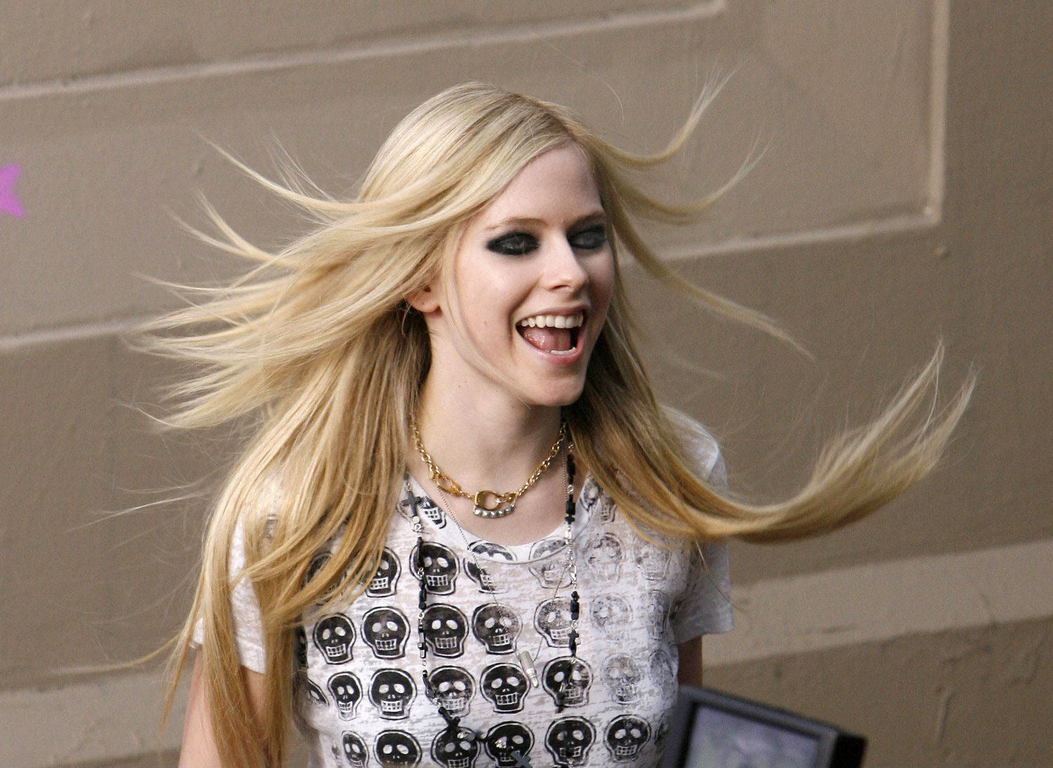 Avril Lavigne wearing black onyx cross necklace by Jenny Dayco 2