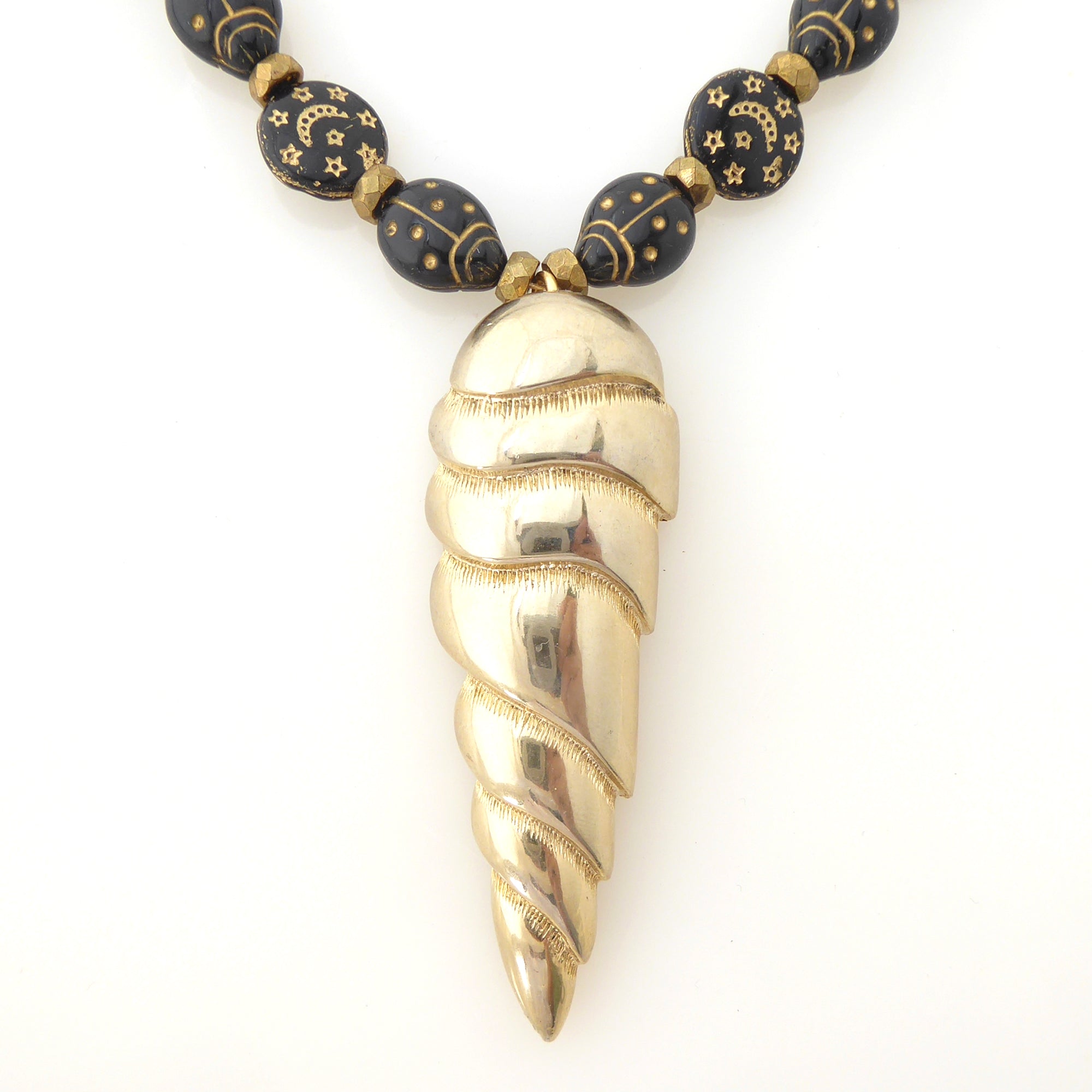 Golden spearhead necklace by Jenny Dayco 4