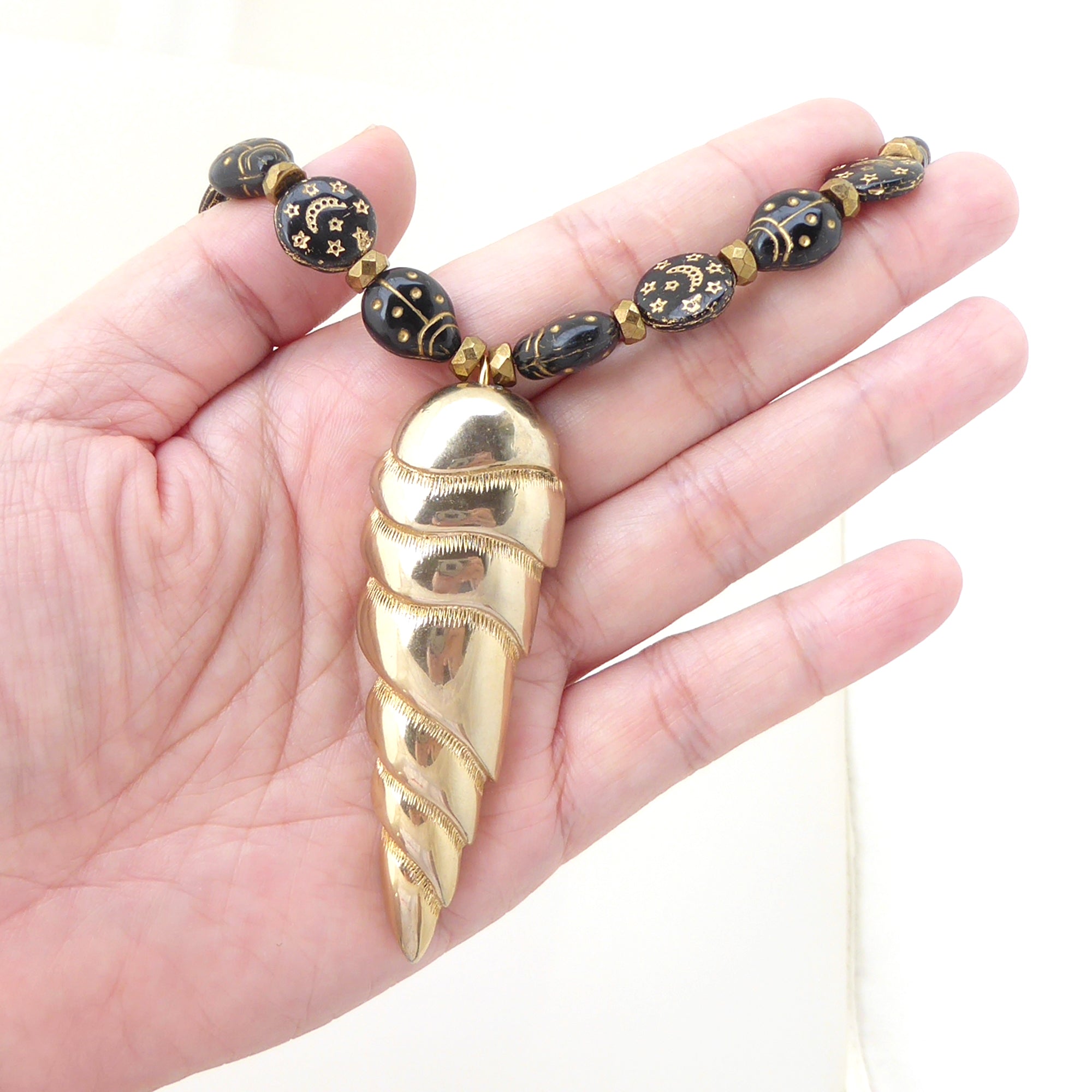 Golden spearhead necklace by Jenny Dayco 6