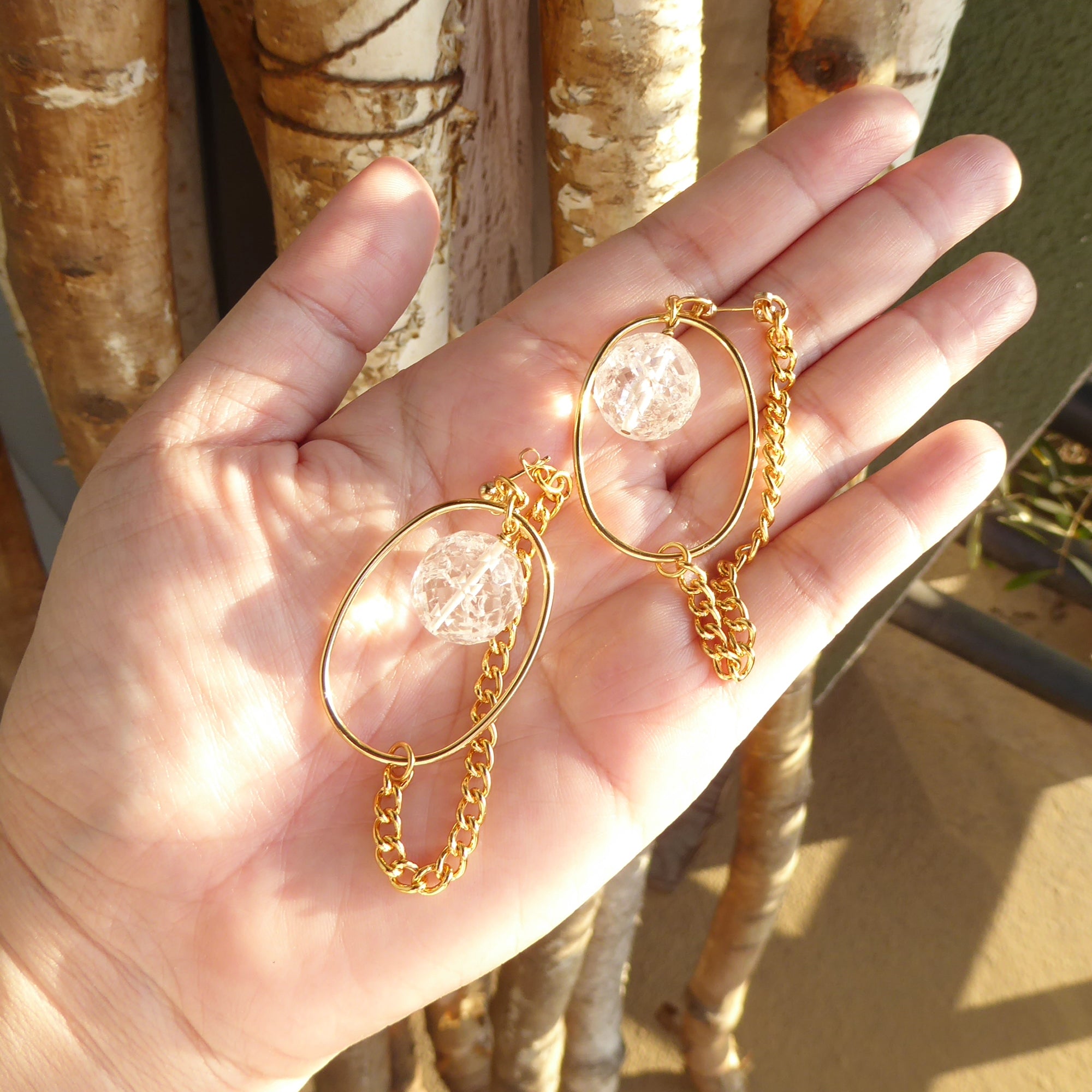 Gold saturn earrings in cracked quartz by Jenny Dayco 6