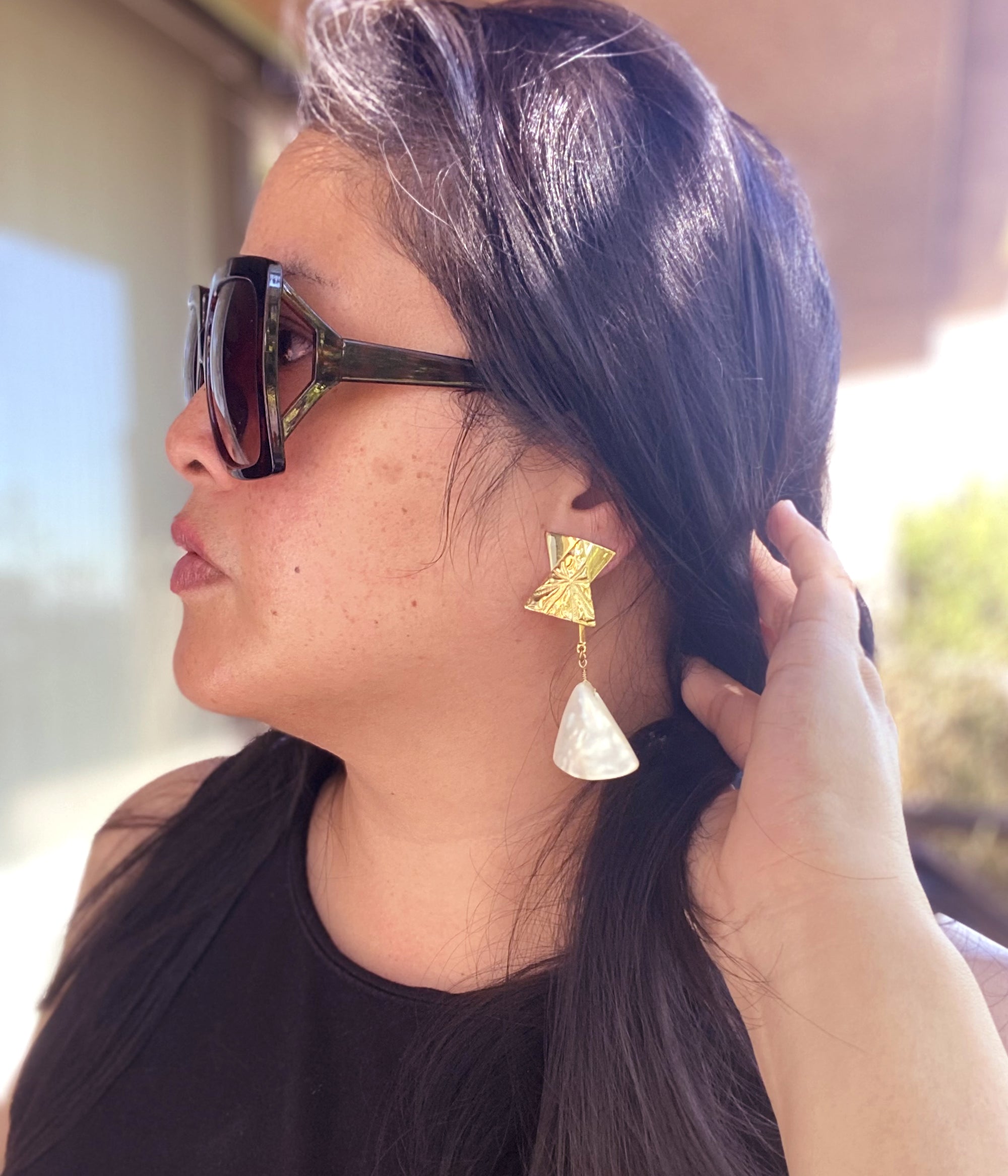 Jenny Dayco wearing Triantan earrings