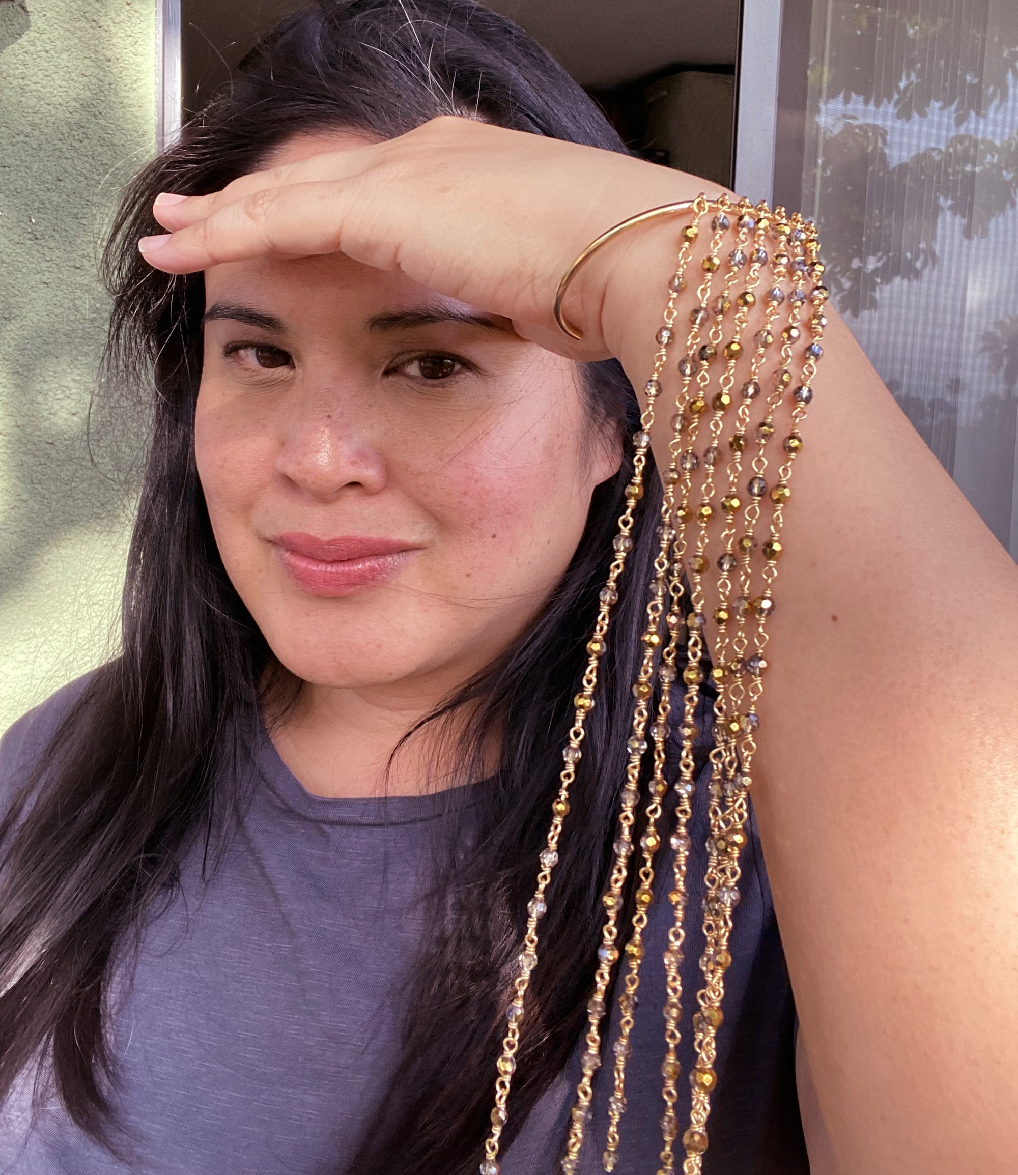 Jenny Dayco wearing a gold filled gray crystal fringe cuff bracelet 1
