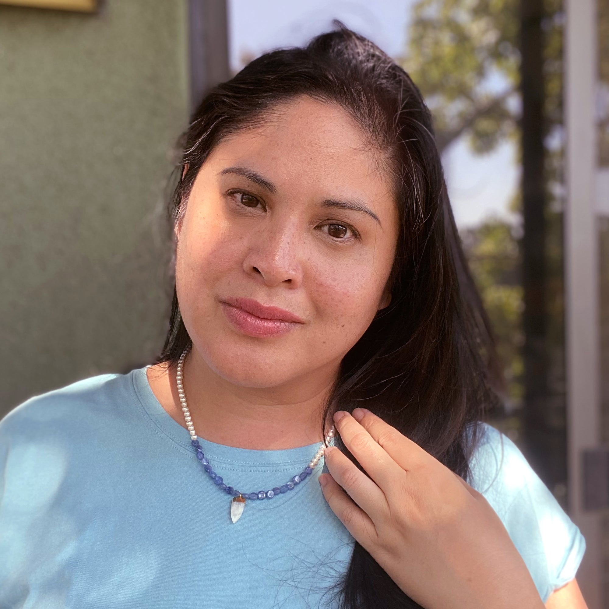 Jenny Dayco wearing a kyanite and pearl moonstone necklace