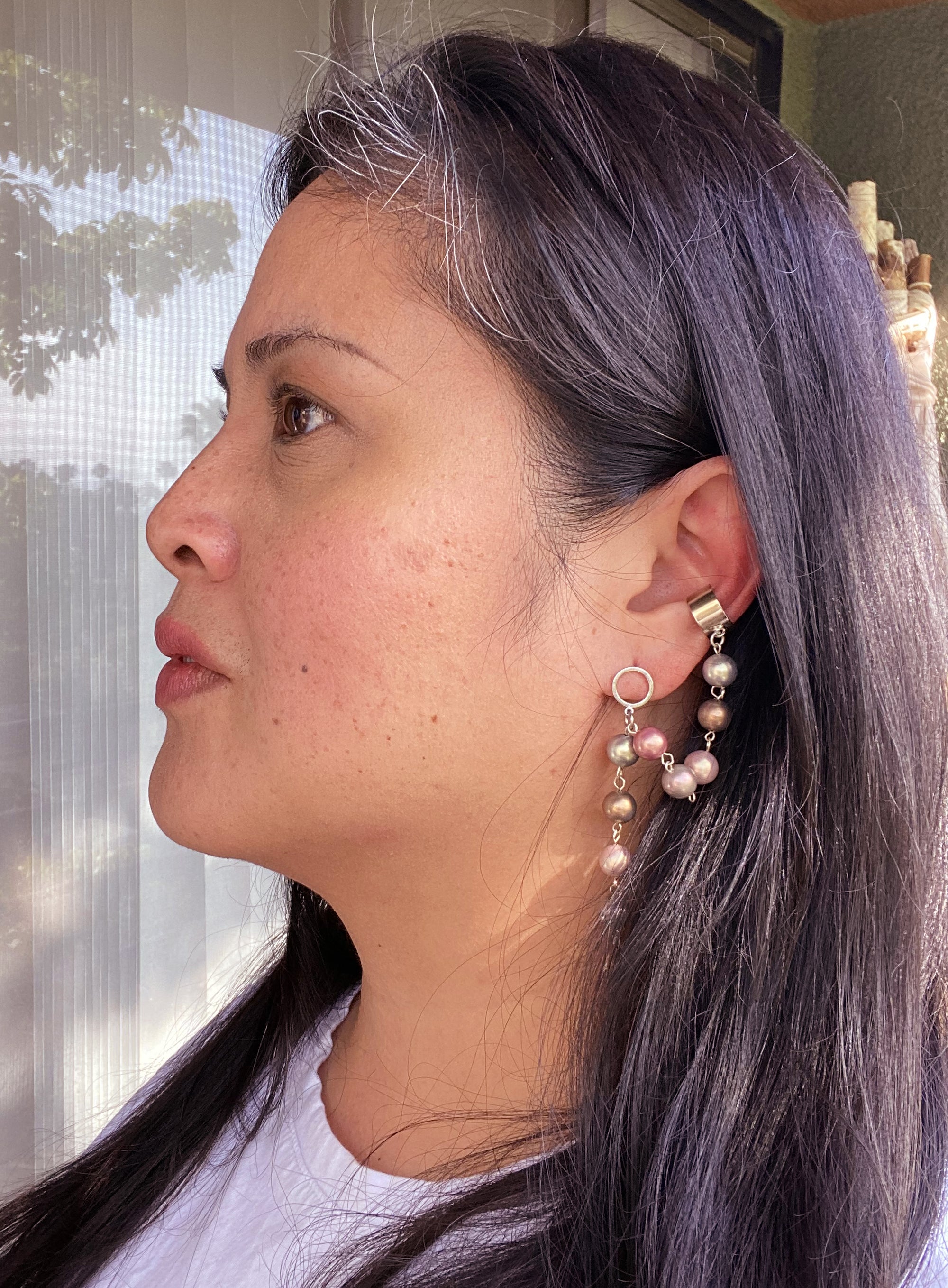 Jenny Dayco wearing a pastel pearl ear cuff