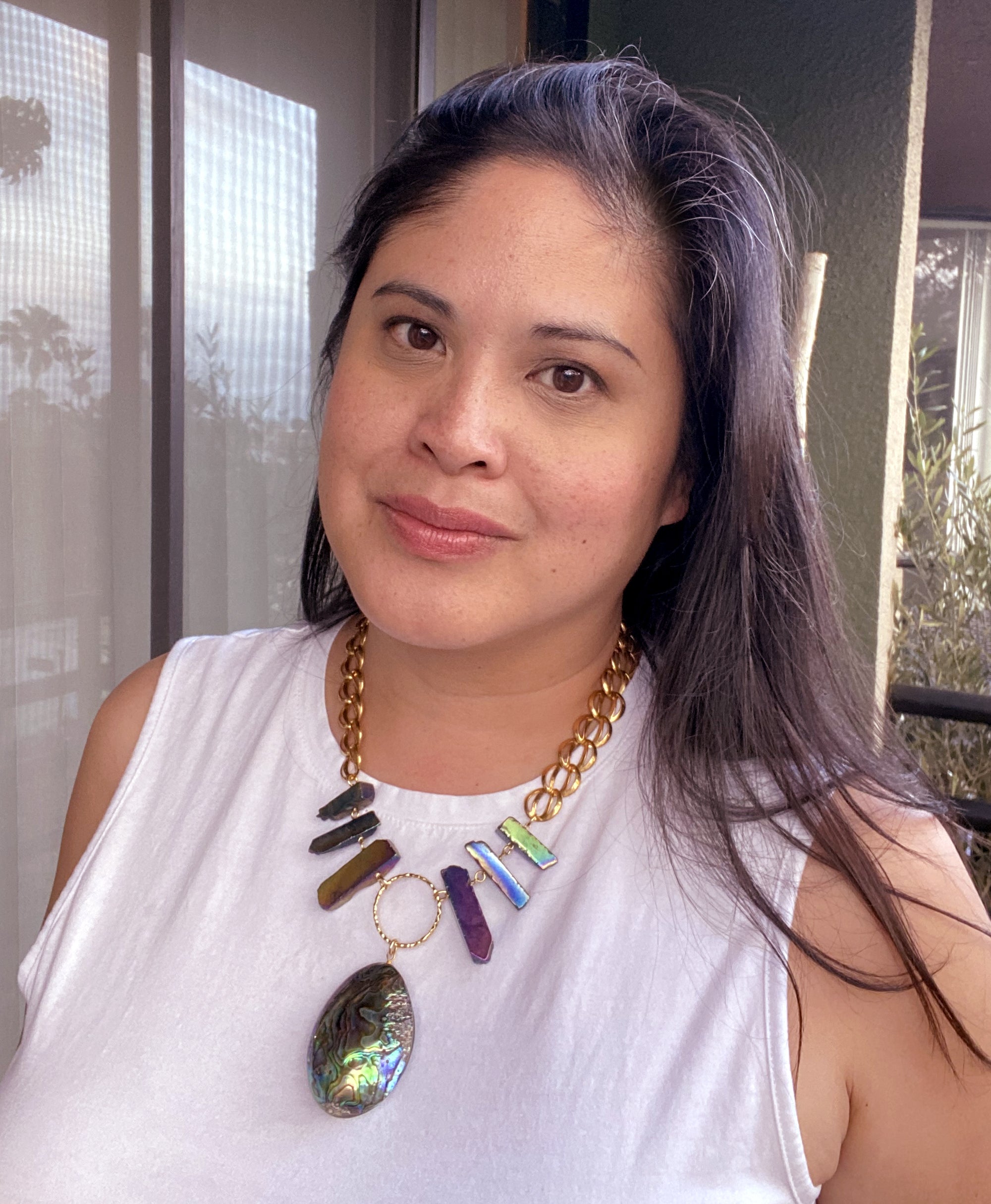 Jenny Dayco wearing a paua teardrop necklace