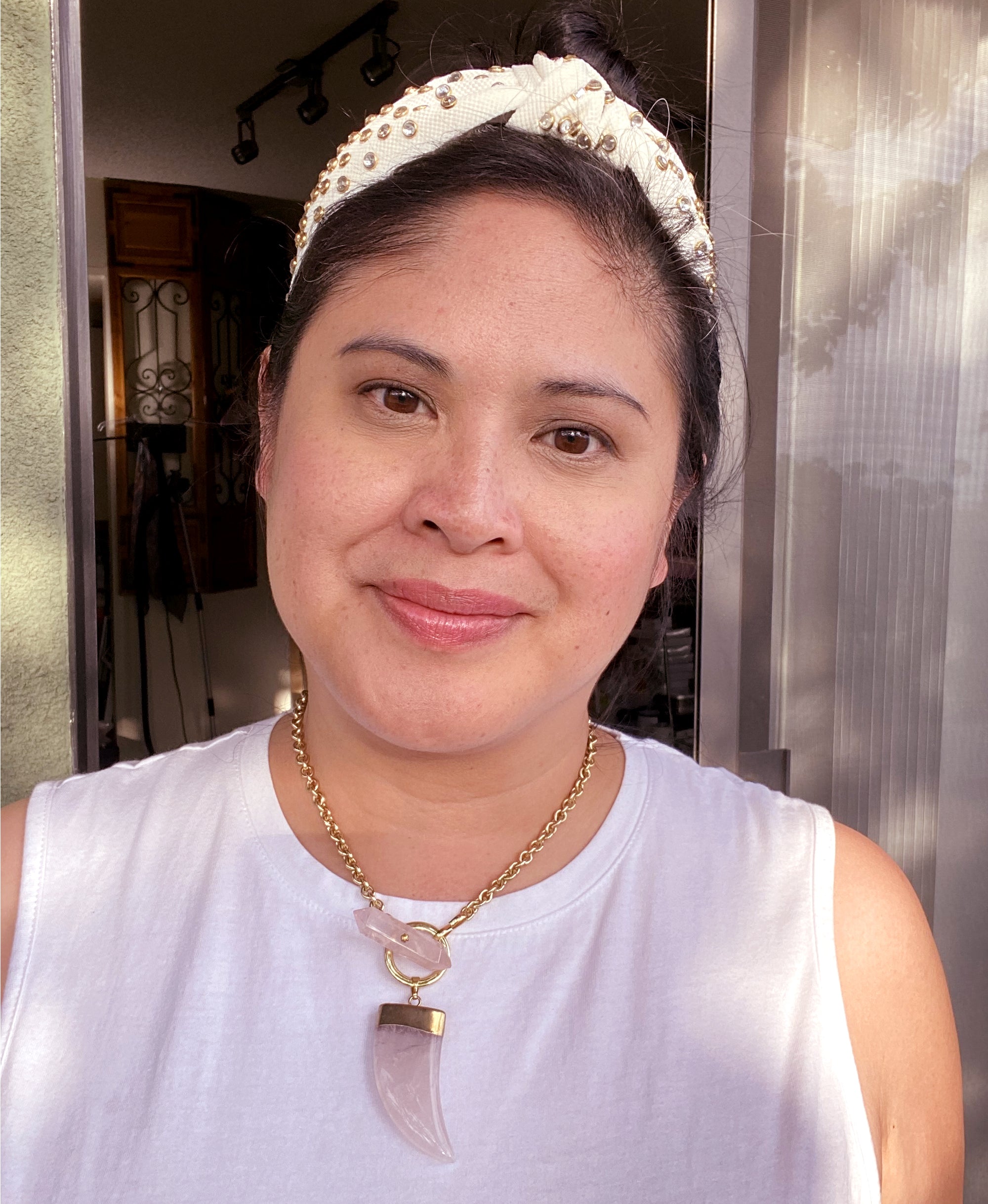 Jenny Dayco wearing a rose quartz horn toggle necklace