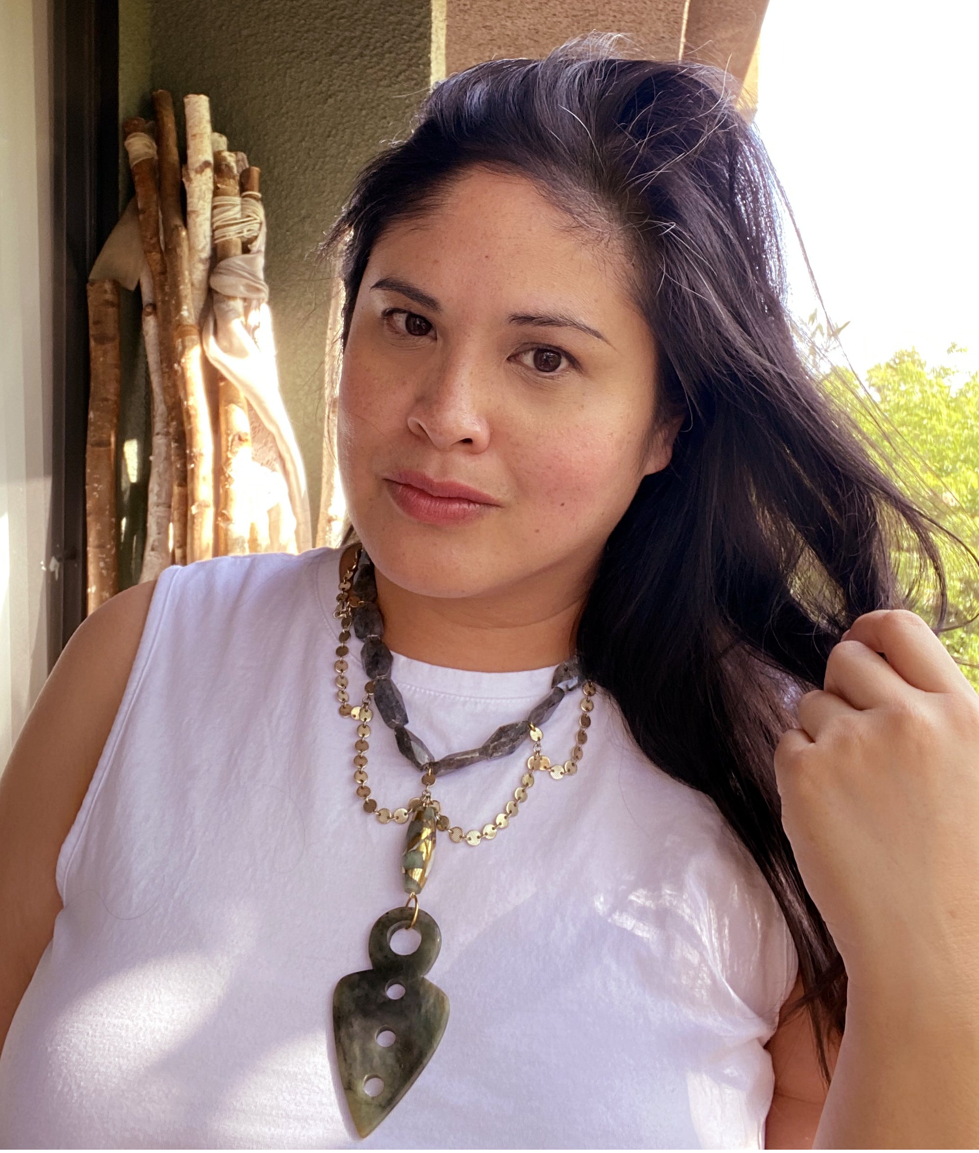 Jenny Dayco wearing a serpentine spearhead necklace