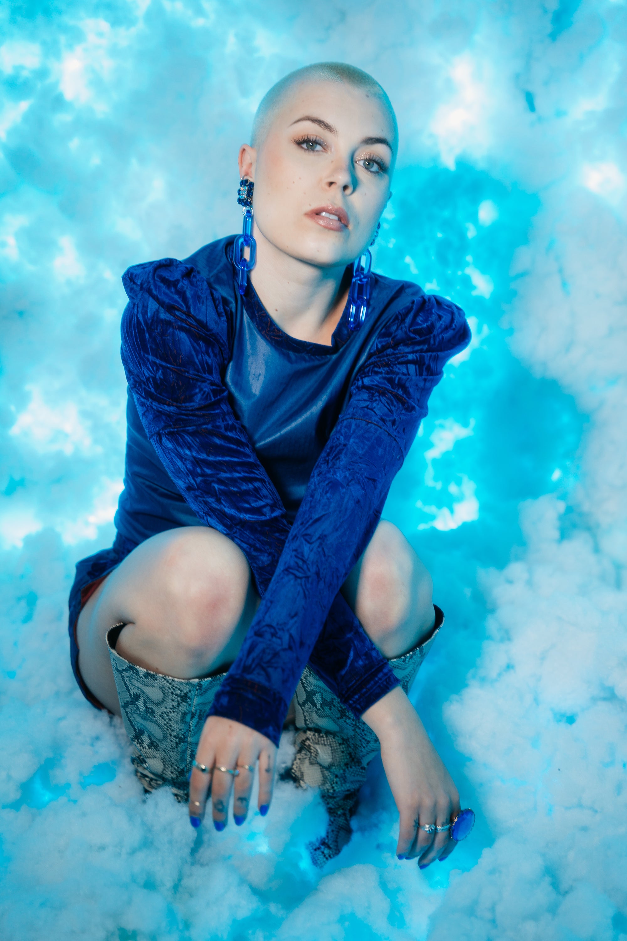Model wearing Jenny Dayco blue rhinestone chain earrings 2
